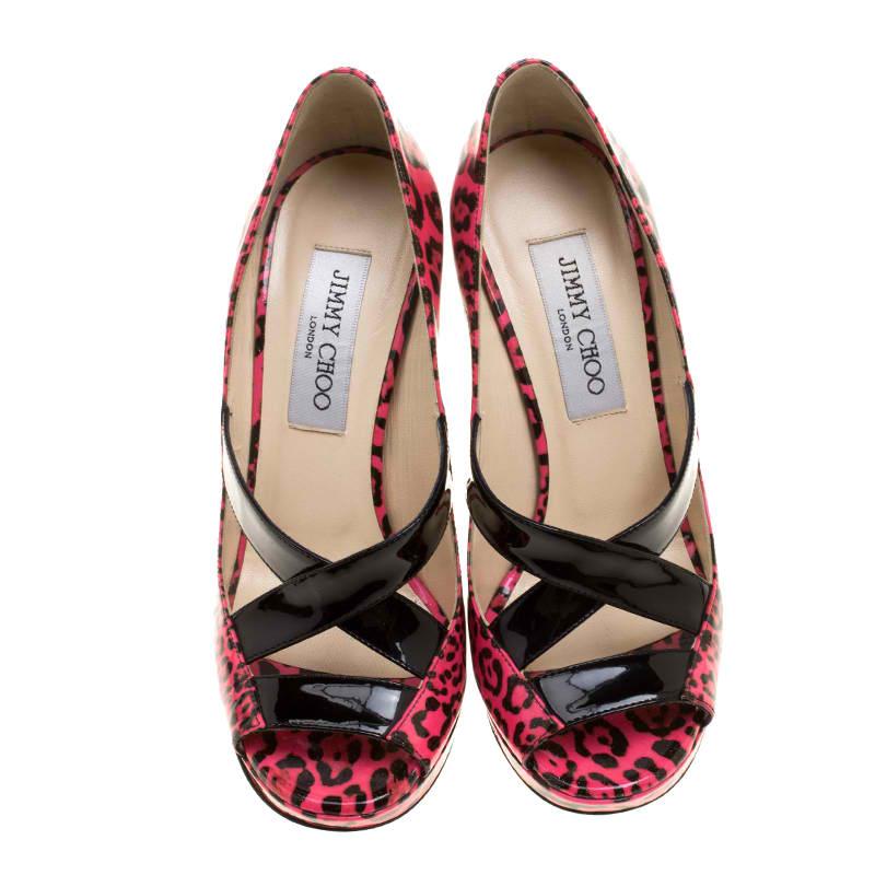 Feel fashionable whenever you step out in this pair of pumps by Jimmy Choo. They've been gloriously crafted from patent leather and designed with leopard prints. They feature peep toes, cutouts, and platforms with 12 cm heels.

Includes: Original