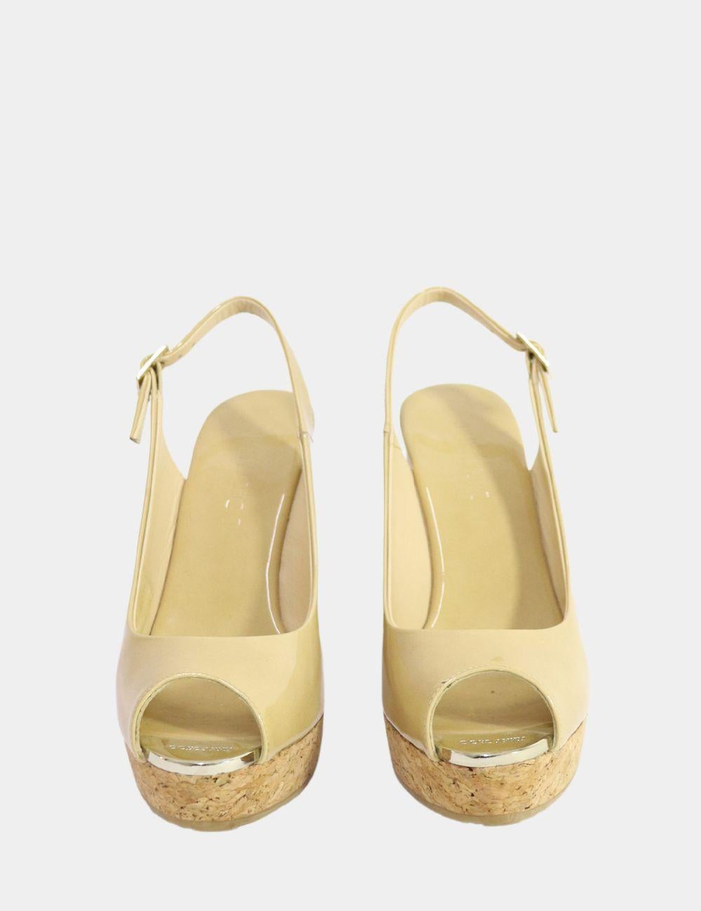 Jimmy Choo Prova Wedge Sandals, features a peep toe, wedge style, and a 3cm platform.

Material: Patent leather
Size: EU 38 / Runs Small
Outsole Length: 20 cm
Outsole Width: Min 4.5 cm - Max 7 cm
Heel: 11cm
Overall Condition: Good
Interior