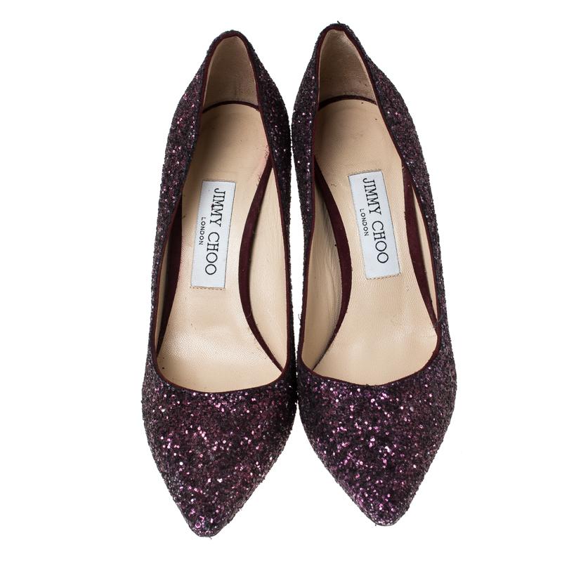Known for their elegant and high fashion designs, Jimmy Choo never fails. Make a style statement while flaunting this pair that has been made in Italy. Covered in purple glitter, they feature pointed toes, 8.5 cm heels and leather insoles.


