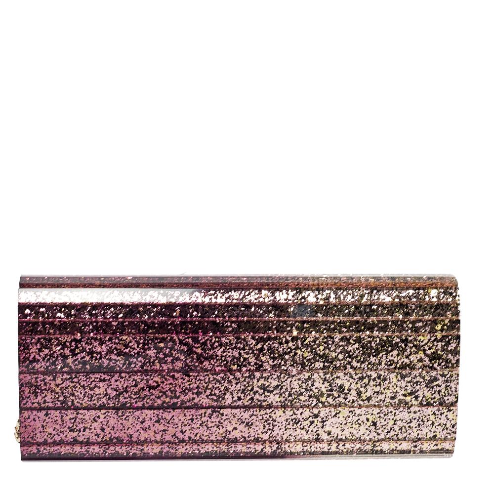 Jimmy Choo's Sweetie clutch gets a stunning update with this purple ombre version. Crafted from glittery acrylic in an elongated shape and equipped with a satin interior, it can be carried using the shoulder chain or as a clutch by tucking the chain