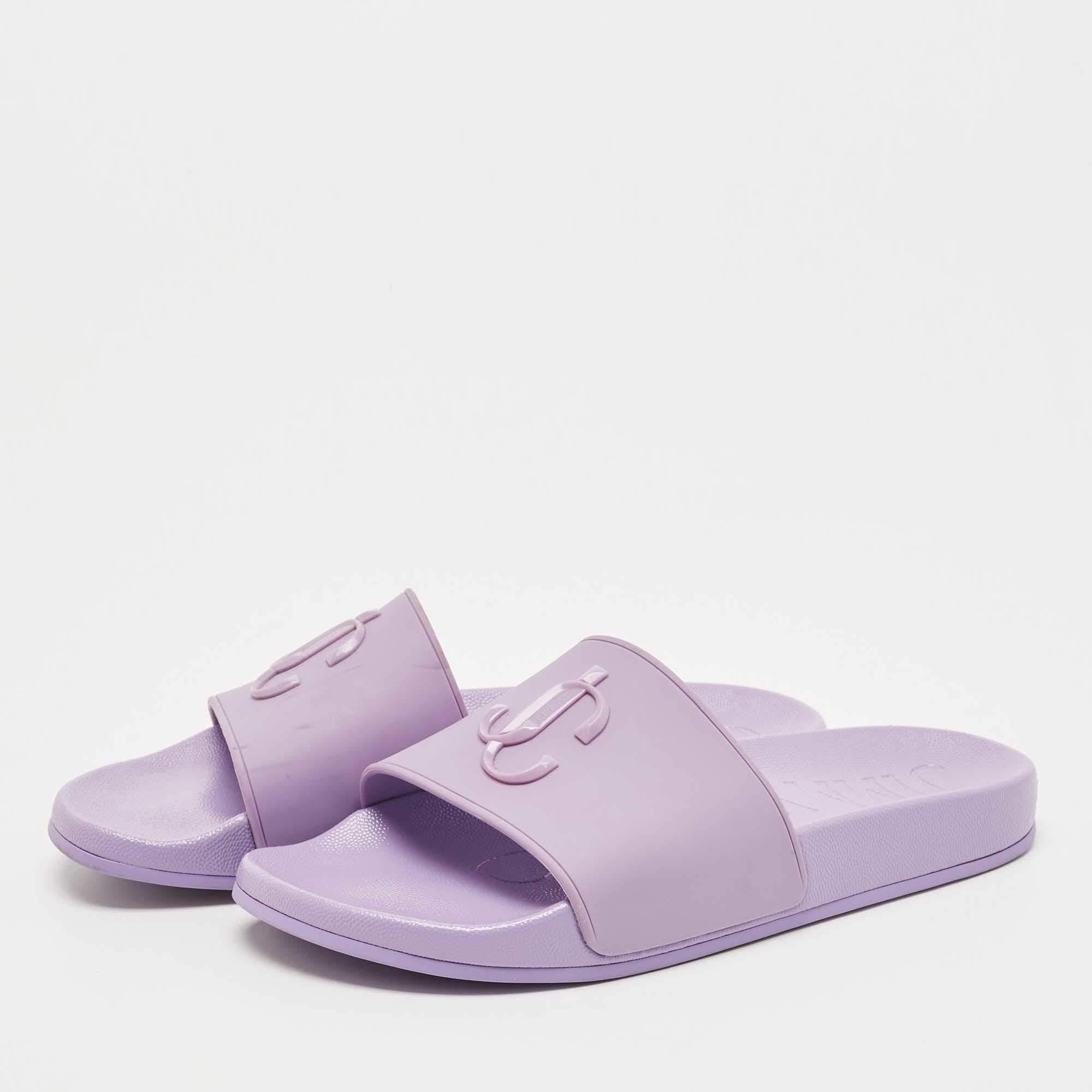 Jimmy Choo's rubber slides for women have the JC branding on the uppers. They're perfect for the beach, vacation days, or everyday use.

