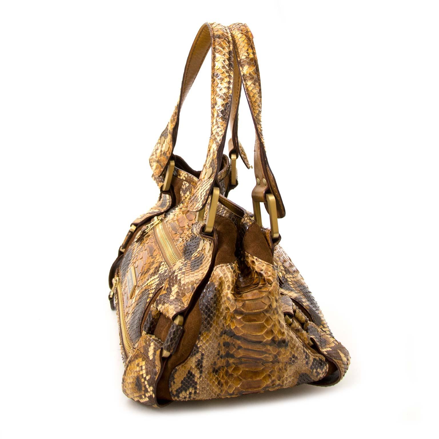 Very good condition

Jimmy Choo Python Brown Bag

If you are looking for a truely unique, beautiful and show-stopping bag, look no further! 

This gorgeous bag by Jimmy Choo is made from brown textured python and features gold-tone metal details.