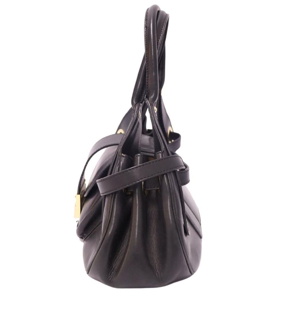 Jimmy Choo Ramona Bag, with a gold-tone hardware, dual rolled shoulder handles, belted detail accents, dual zip pockets at interior and flip flop closure.

Material: Leather 
Hardware: Gold
Height: 20cm
Width: 33cm
Depth: 12cm
Shoulder Drop: