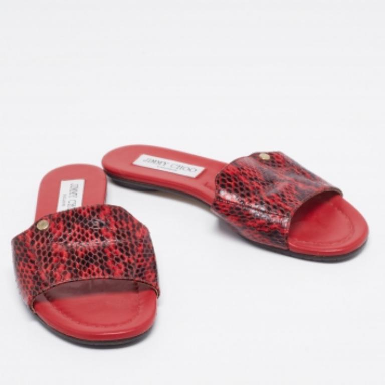 For days of ease and style, Jimmy Choo created these flat slides. They have uppers made from python leather in red and black and insoles lined with leather for comfort. The slides will come in handy with many of your outfits.