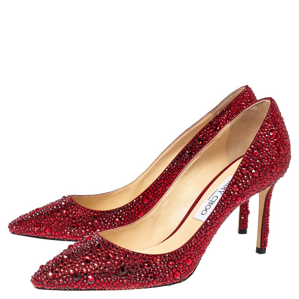 Known for their elegant and high fashion designs, Jimmy Choo never fails. Make a style statement while flaunting this pair that has been made in Italy. Crafted in a sleek silhouette, they are covered with crystals all over, feature pointed toes, 11