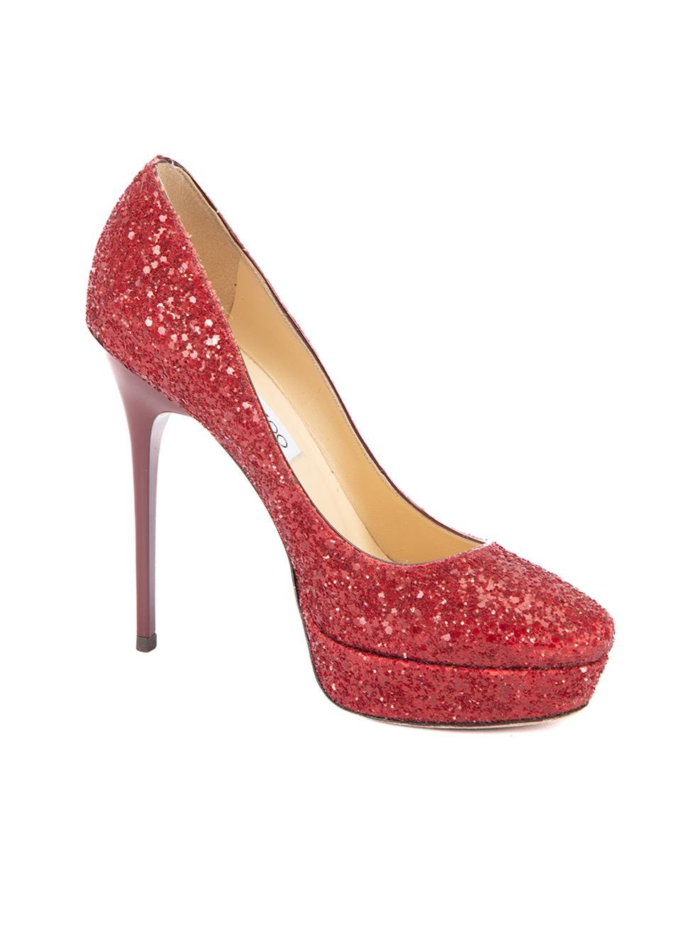 CONDITION is Very good. Minimal visible wear to shoes is evident. Pulled thread to left heel can be seen on this used Jimmy Choo designer resale item. 



Details


Red

Glitter

Slip on pumps

Almond toe

Platform high heels

Leather