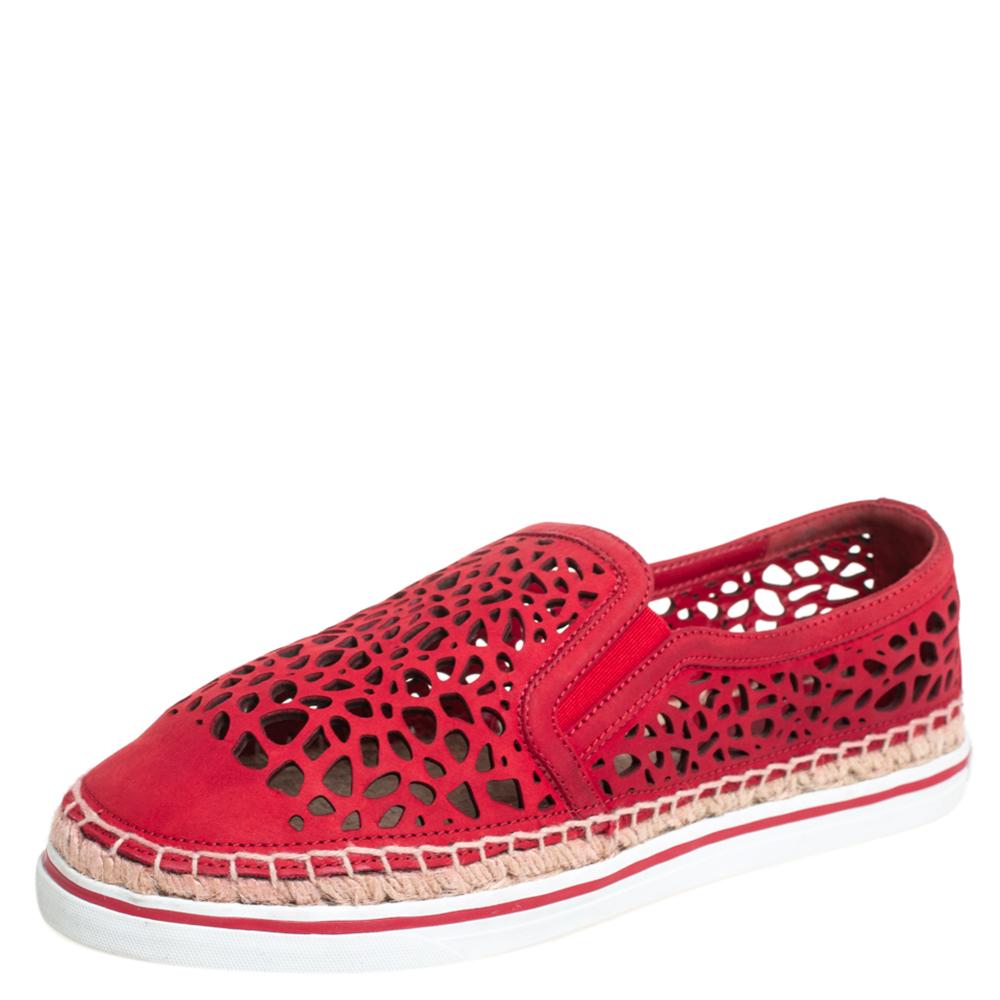 Created to provide comfort and designed to fetch onlookers, this pair of espadrille sneakers by Jimmy Choo is absolutely a worthy buy. Featuring round toes and espadrille midsoles, the sneakers have been crafted from red leather. The vamps have