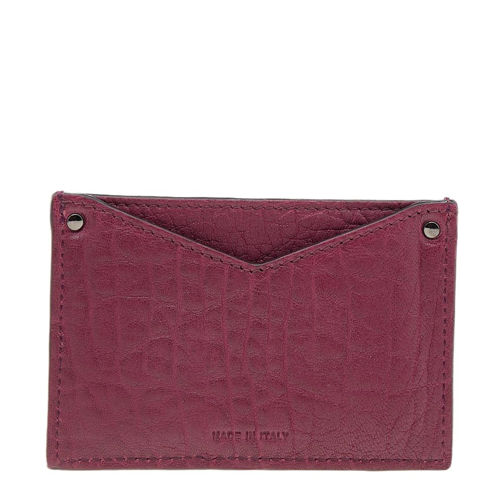This Jimmy Choo cardholder flaunts a chic design and is truly functional. Made from red leather, it comes with several pockets for your cards and is finished with black-tone hardware.

Includes: Original Dustbag, Original Box, Info Booklet,