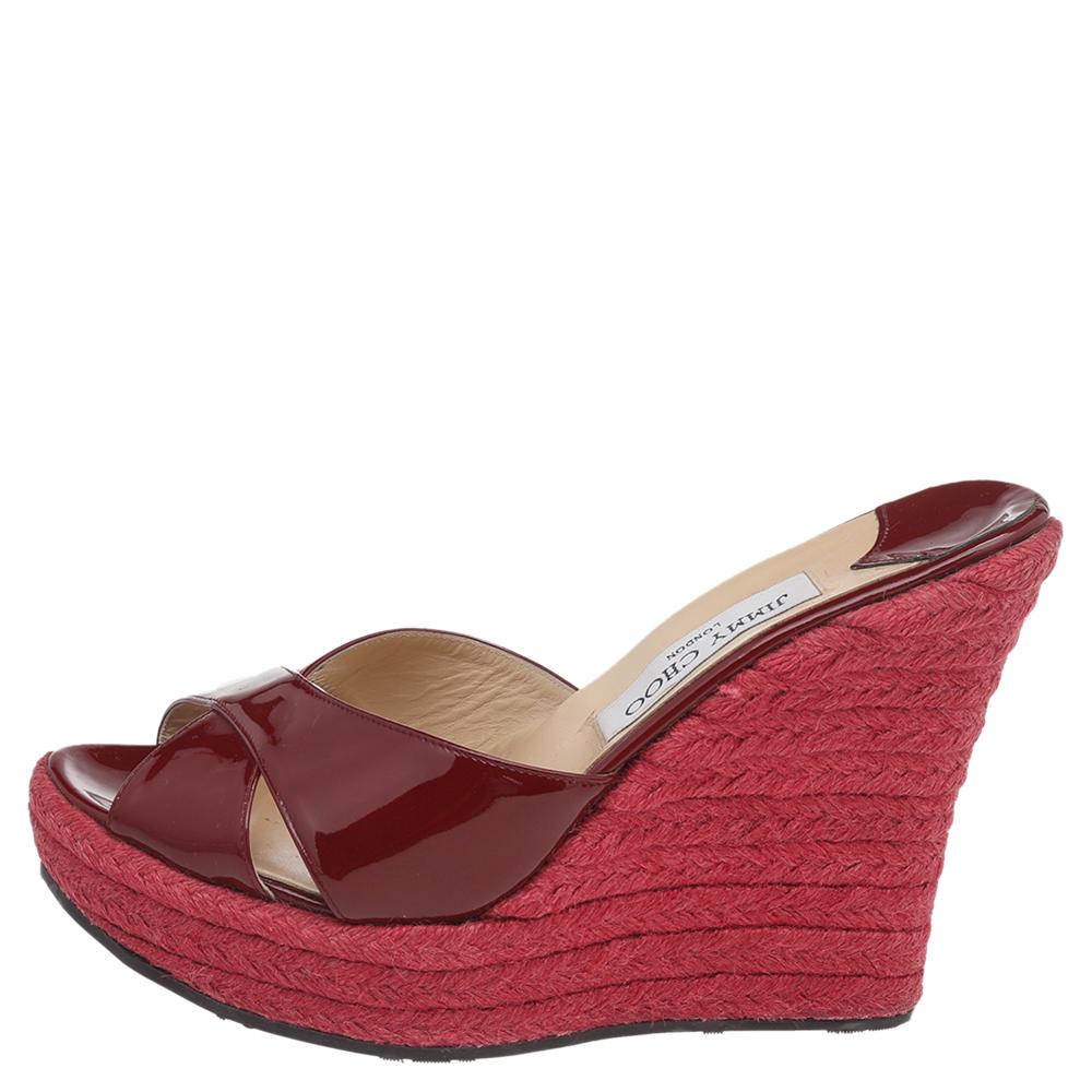 These lovely Phyllis slides by Jimmy Choo will bring you the right amount of style and comfort. They feature cross straps on the vamps made from red patent leather and 12.5 cm espadrille wedges. They are pretty and easy to flaunt.

Includes: