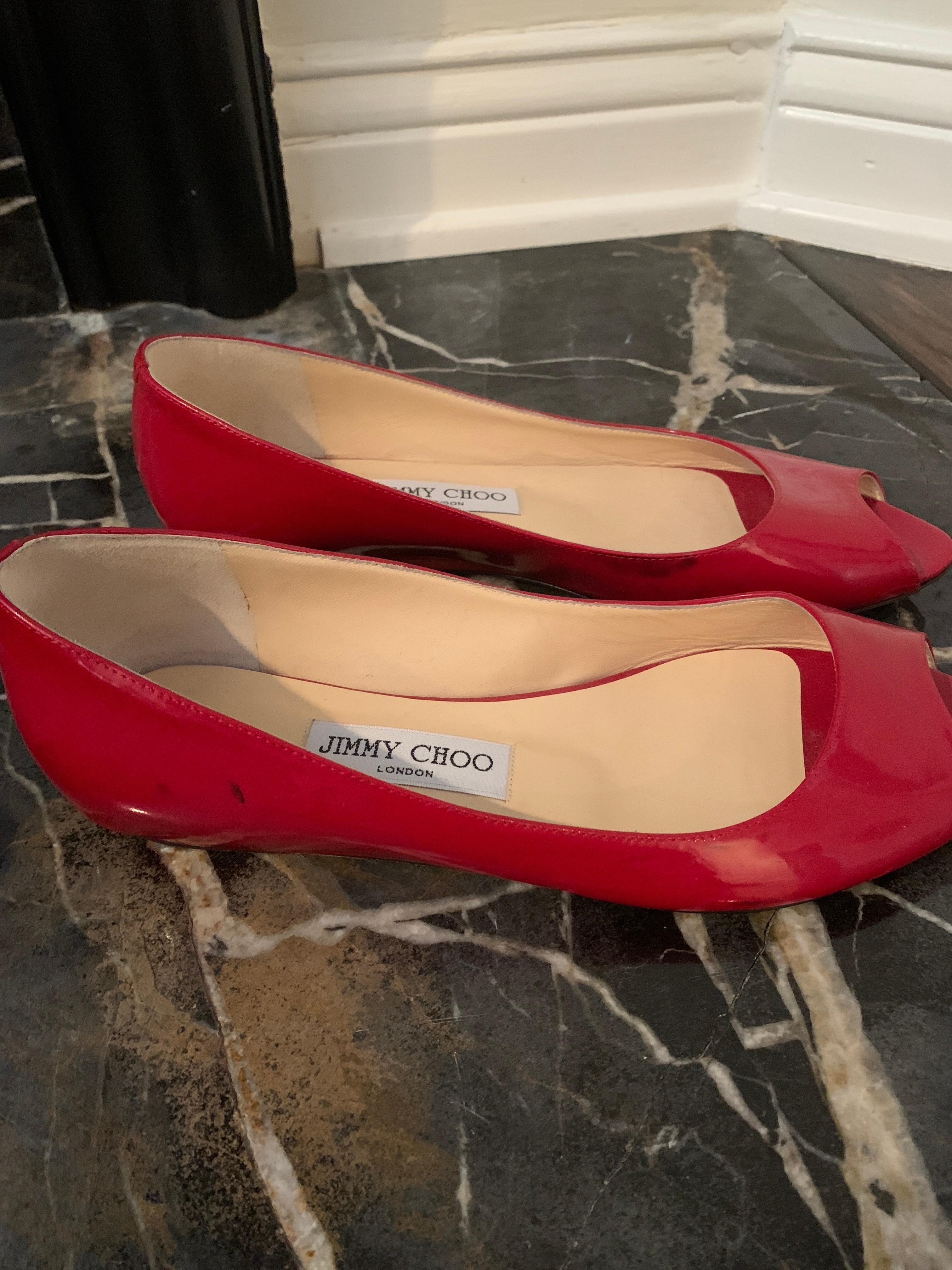 Jimmy Choo Red Patent Peep Toe Flats.
Never Been Worn. 
Size 40 
Slight Heel 