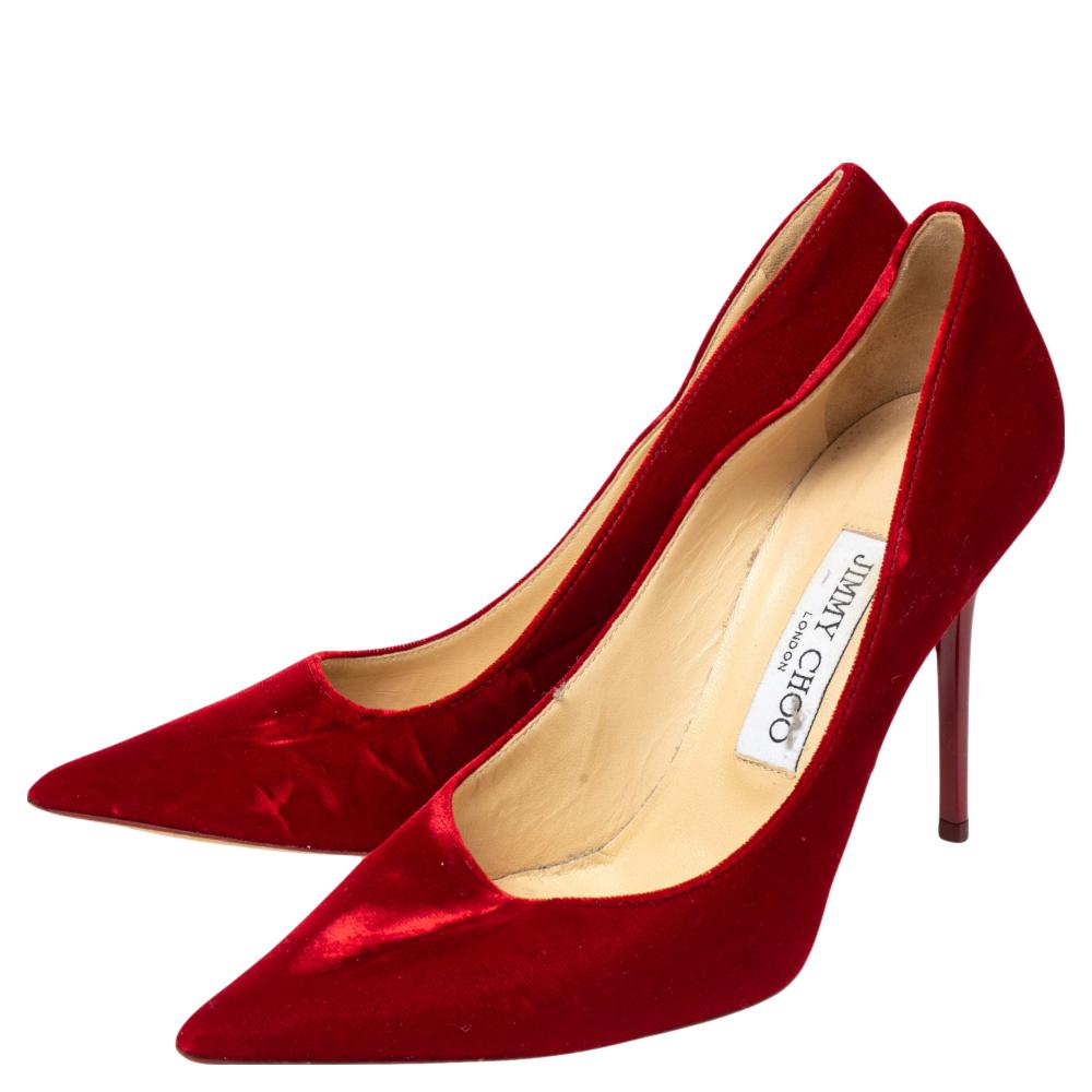 These classy pumps from Jimmy Choo are here to add a magical touch to your style. Crafted from velvet, they carry a gorgeous red shade with pointed toes, comfortable insoles, and 12 cm heels. Walk in them and you are sure to have the best day.

