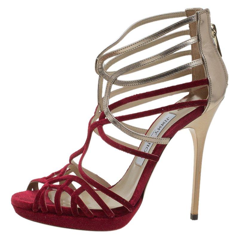 The 'Maury' strappy sandals from Jimmy Choo are the perfect choice for dressed-up vacation nights.  Crafted from red velvet and metallic leather, these open toe sandals feature cut-out straps that frame your foot beautifully. It is finished with