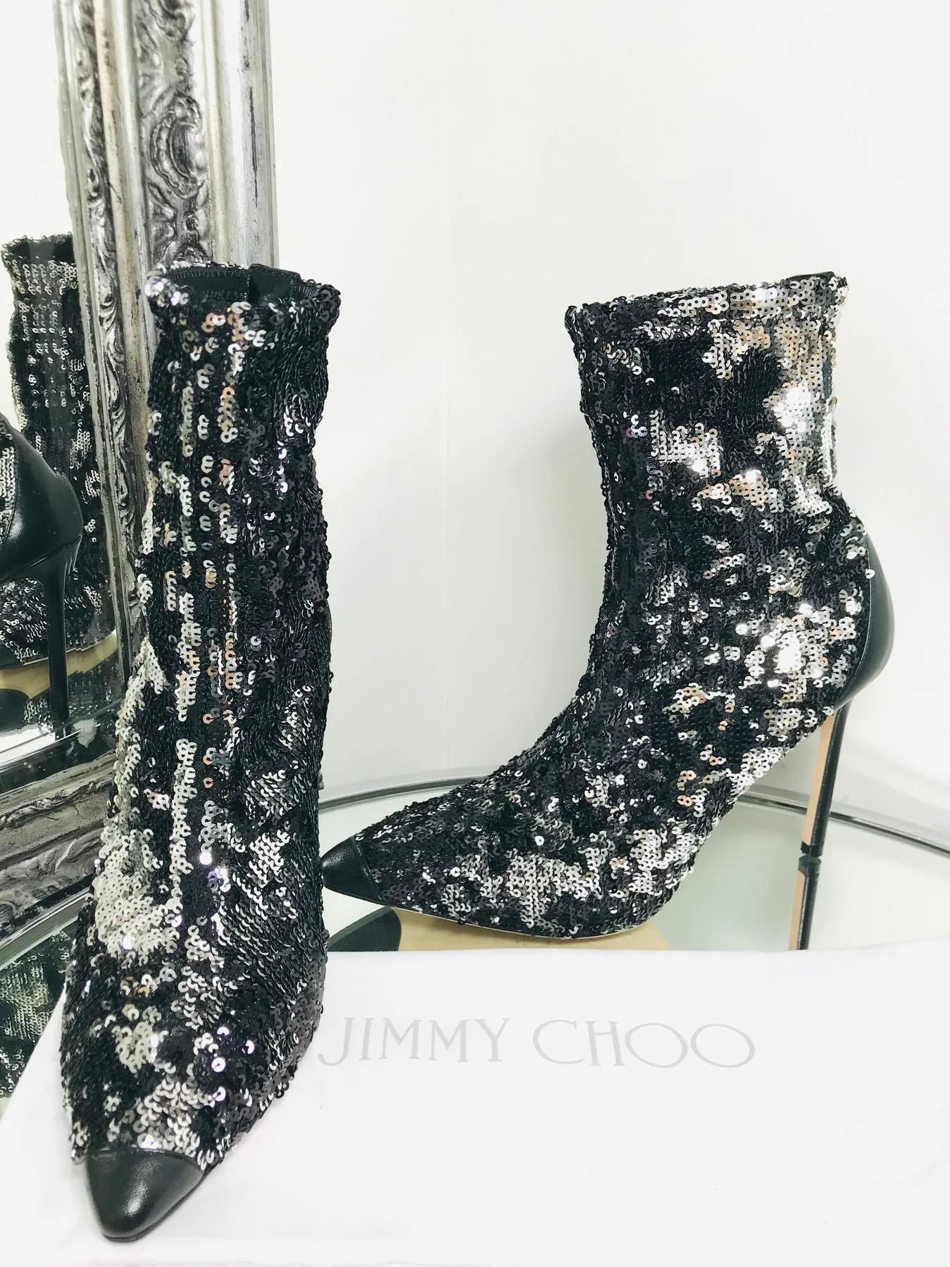 Jimmy Choo Ricky 100 Black Leather-Trimmed Sock Boots

Designed with double-faced sequin embellishment. Featuring pointed toe, leather sole and 10.5cm heel.

Additional information:
Size – 39
Condition – Very Good 
Comes with- Dust Bag