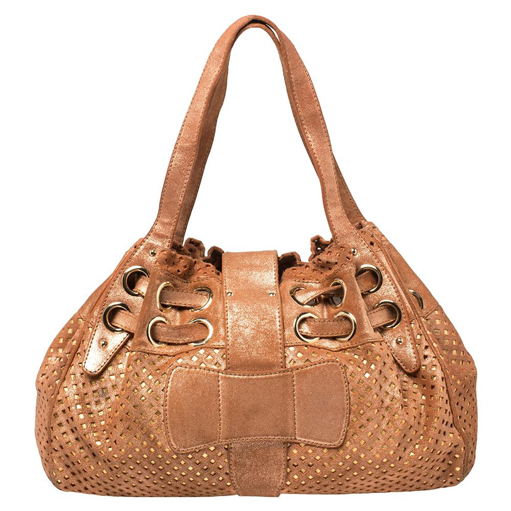 Own this gorgeous Jimmy Choo Riki bag today and light up your closet! Crafted from perforated suede, this stunning number has a flap top with a signature lock and a spacious Alcantara interior. It also features two top handles, gold-tone hardware,