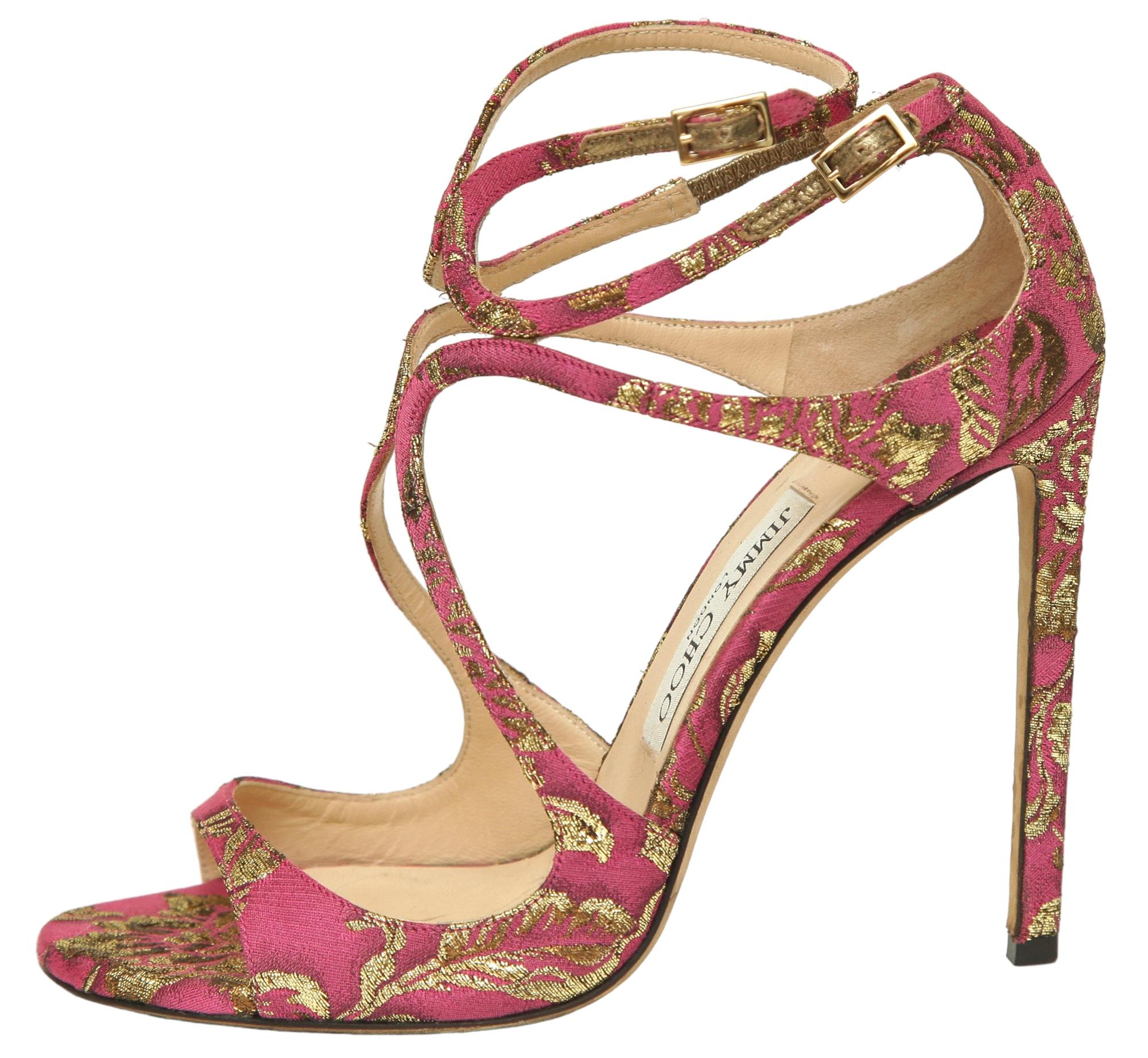 GUARANTEED AUTHENTIC JIMMY CHOO METALLIC BROCADE LANCER SANDALS

Retail excluding sales taxes $800

Details:
- Metallic pink and gold brocade uppers.
- Double ankle strap.
- Leather insole and sole.
- Comes with designer dust bag.

Size: