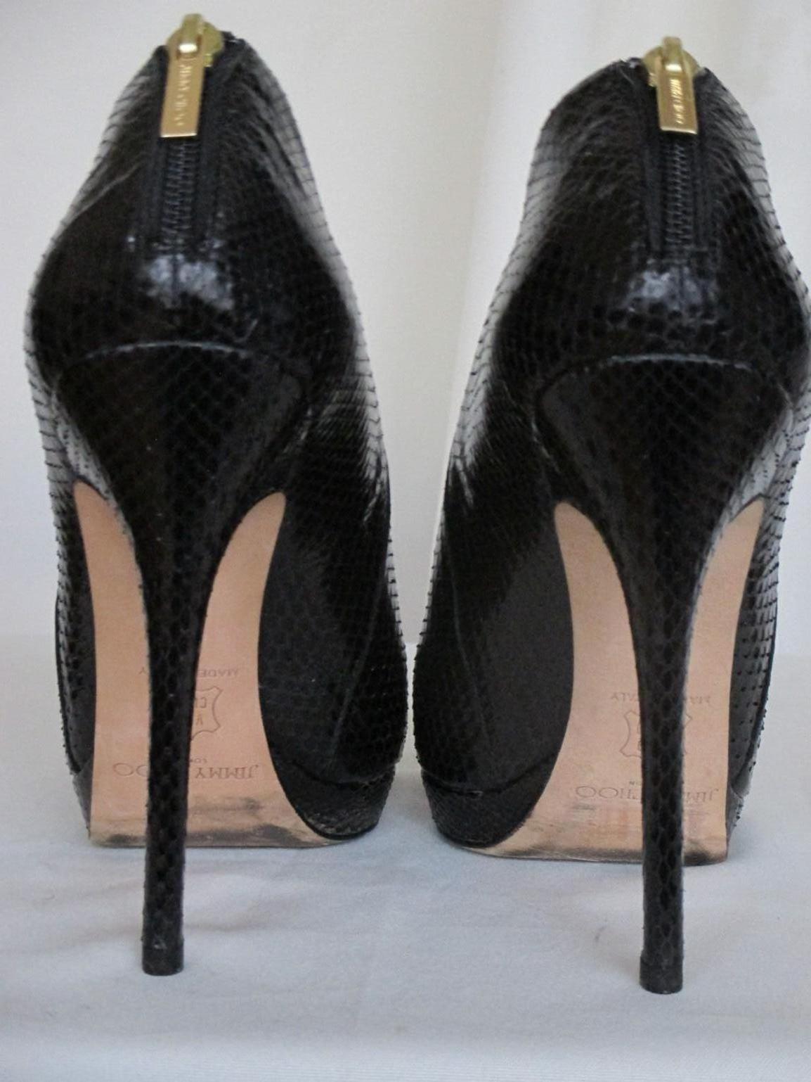 Black snakeskin leather platform boots with pointed toe. 
Back gold color zipper closure with nude leather interior. 
Size EU 40 / US 8/ UK 7.5  the heel is aprox. 13 cm high.
Minor signs of wear at the bottom, rarely worn.
No dustbag 

Please note