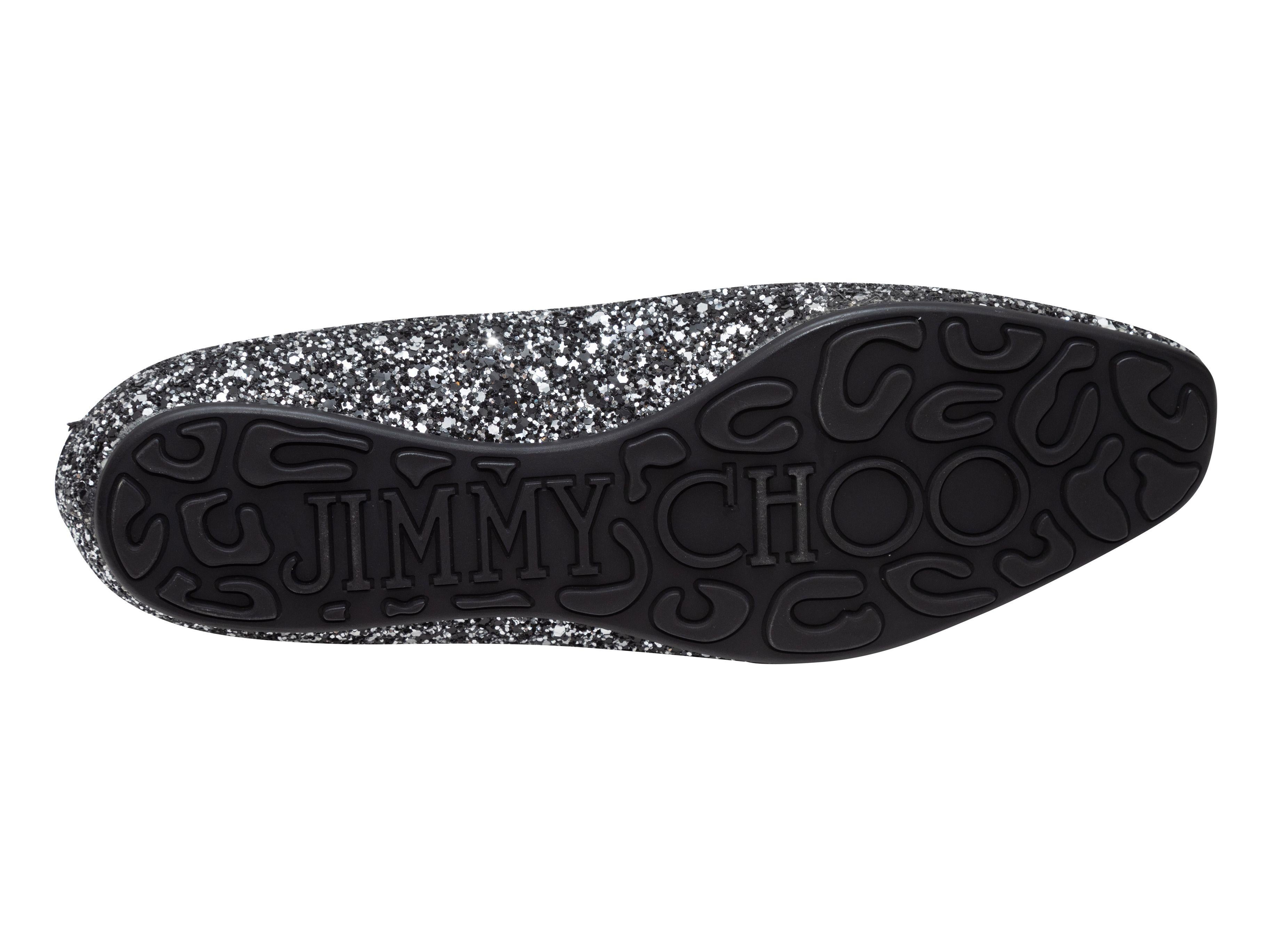 Product Details: Silver and black glitter loafers by Jimmy Choo. Patent leather trim.

Designer Size: 39.5
US Recommended Size: 9.5

Condition: Pre-owned. Very good. Minor signs of wear. Slight loss of shape.