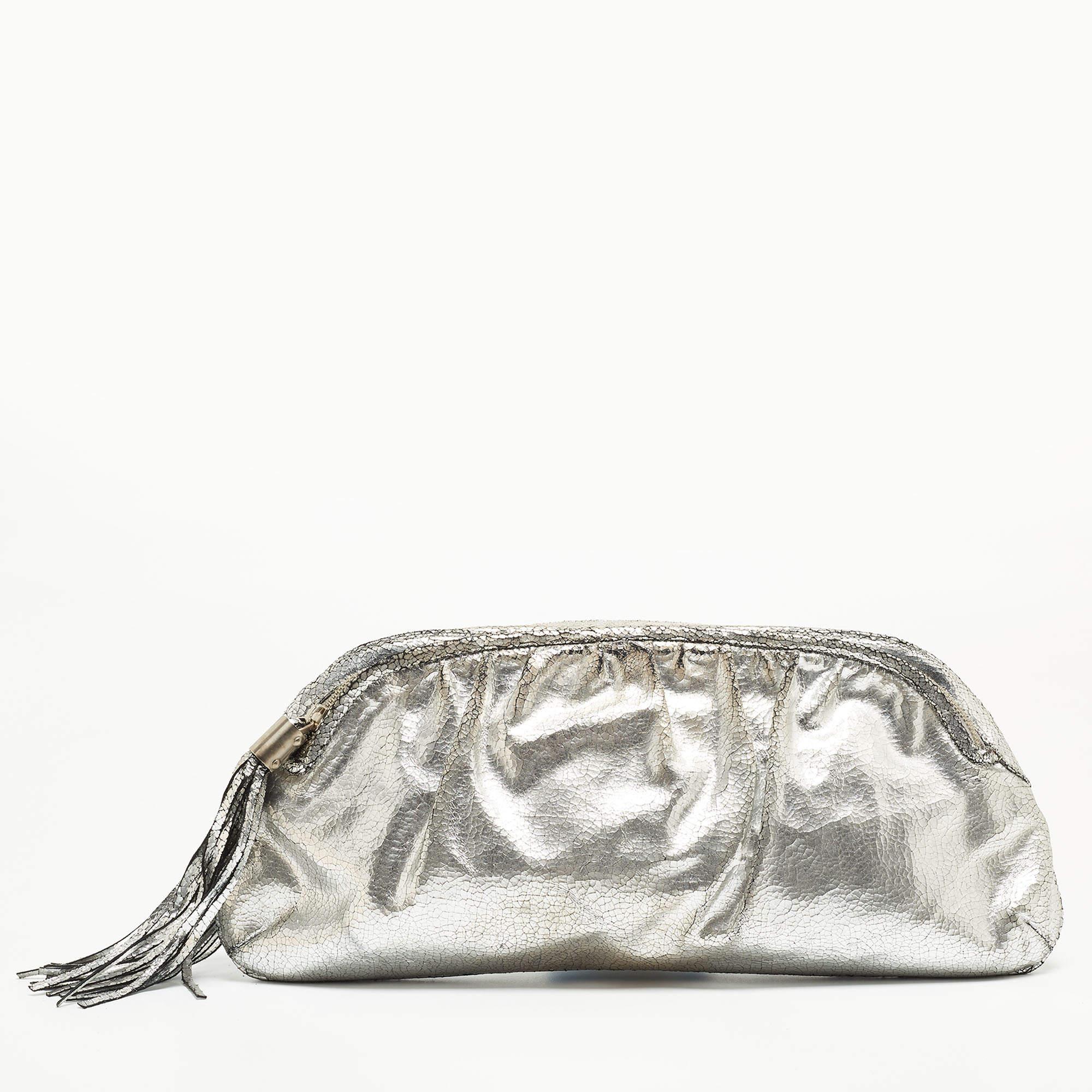 This clutch is just the right accessory to compliment your chic ensemble. It comes crafted in quality material featuring a well-sized interior that can comfortably hold all your little essentials.

Includes: Brand Dustbag


