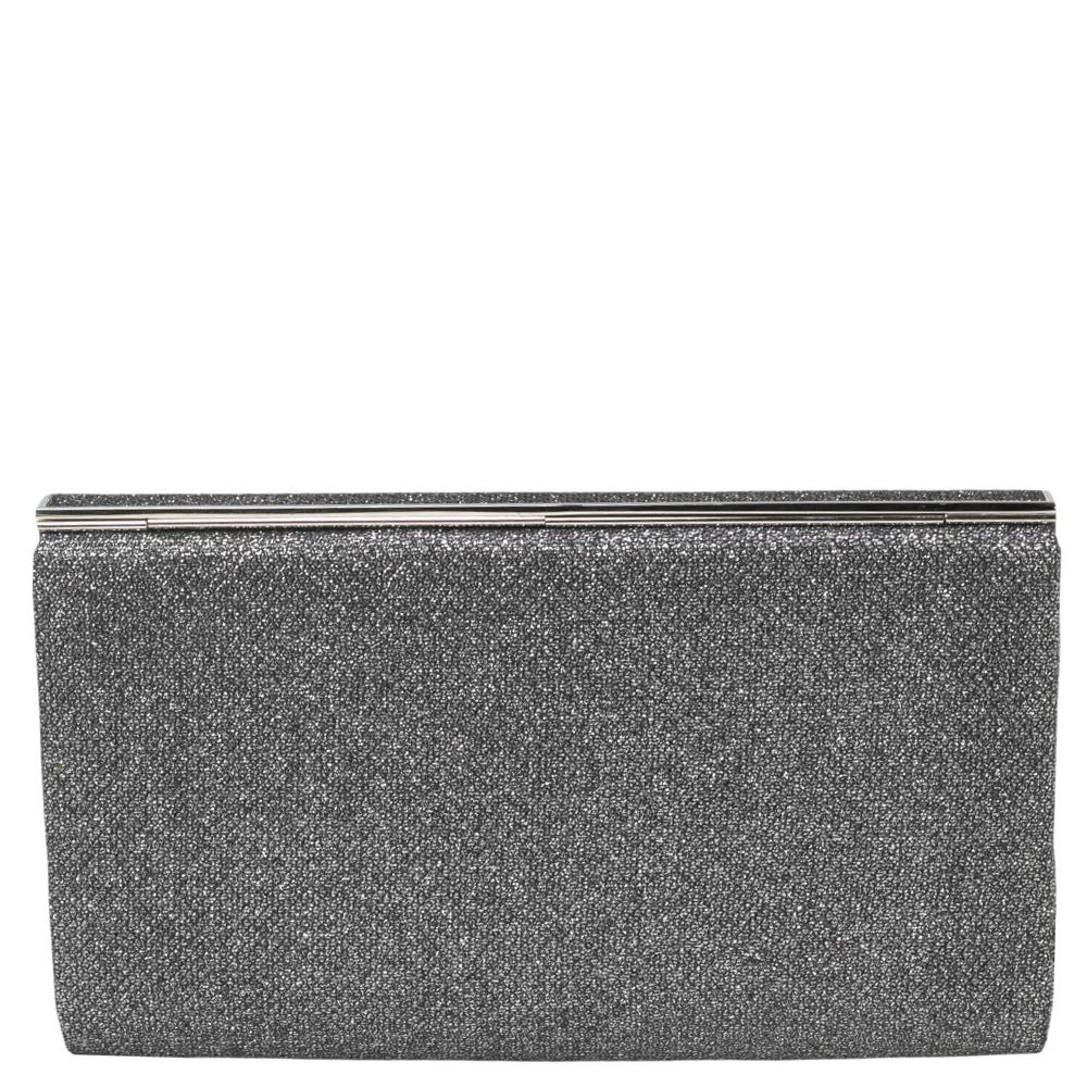 This gorgeous glitter-infused Cayla clutch by Jimmy Choo is a perfect example of the label's commitment to being chic, contemporary, and elegant at the same time. Designed to dazzle, this clutch has a closure that opens to a fabric-lined interior.

