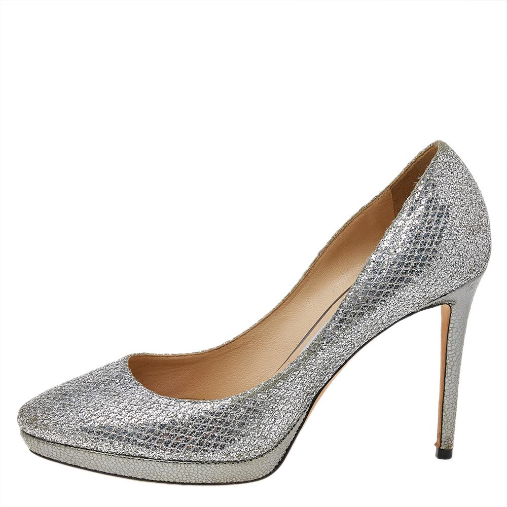 These pumps from Jimmy Choo are love at first sight! The silver-hued beauties are exquisitely crafted from glitter fabric and feature an elegant design. They flaunt platforms and come equipped with comfortable insoles and high heels. These pumps can