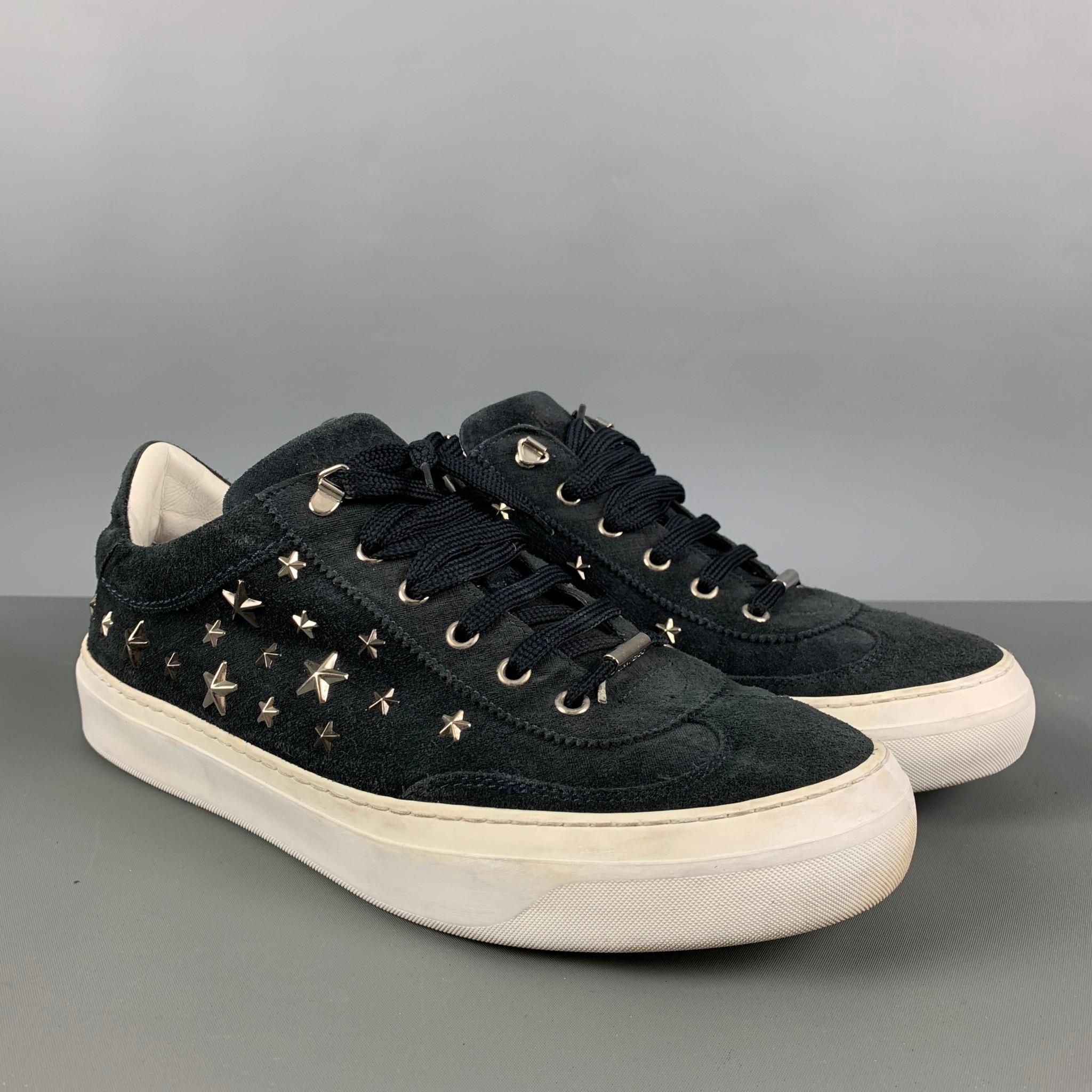 JIMMY CHOO sneakers comes in a black suede featuring silver stars details, rubber sole, and a lace up closure. Made in Italy.

Good Pre-Owned Condition.
Marked: 43

Outsole: 12 in. x 4.25 in.  

SKU: 124642
Category: Sneakers

More Details
Brand: