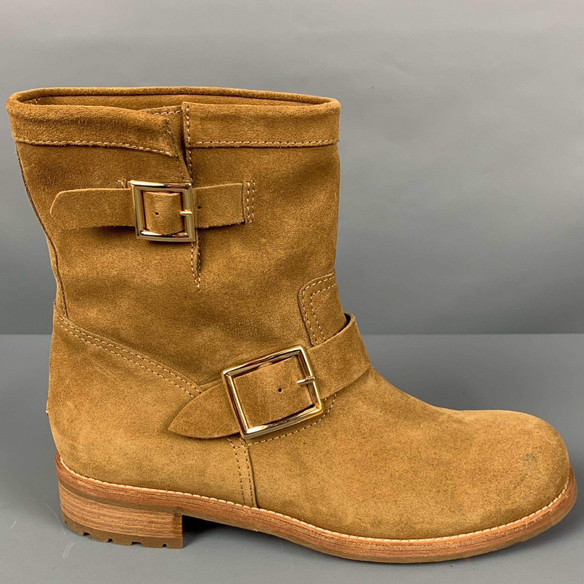 JIMMY CHOO
boots in a camel suede featuring a pull on style, gold tone hardware, and double buckle. Made in Italy.New without Box. 

Marked:   40.5 

Measurements: 
  Length: 10.75 inches Width: 3.75 inches Height: 8.5 inches 
  
  
 
Reference: