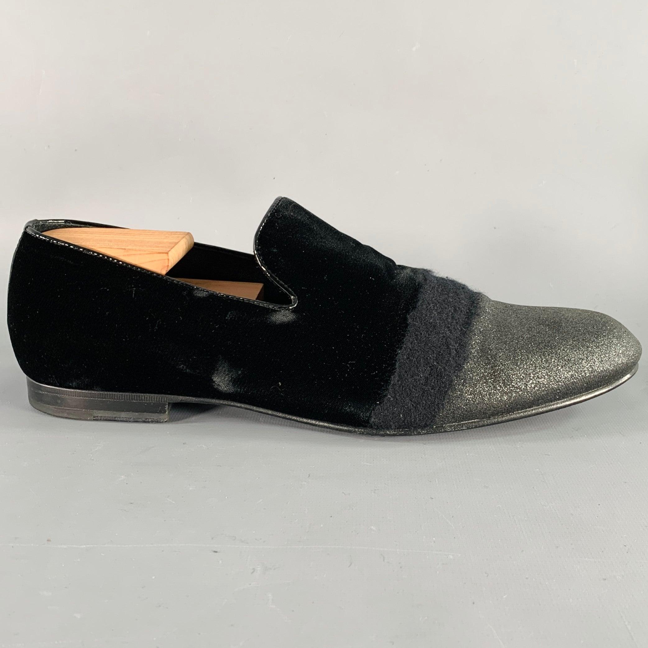 JIMMY CHOO loafers
in a black velvet and grey glitter featuring a striped mixed material design, patent leather trim, and slip on closure. Comes with dust bag Shoe trees not included. Made in Italy.Very Good Pre-Owned Condition. Minor signs of wear