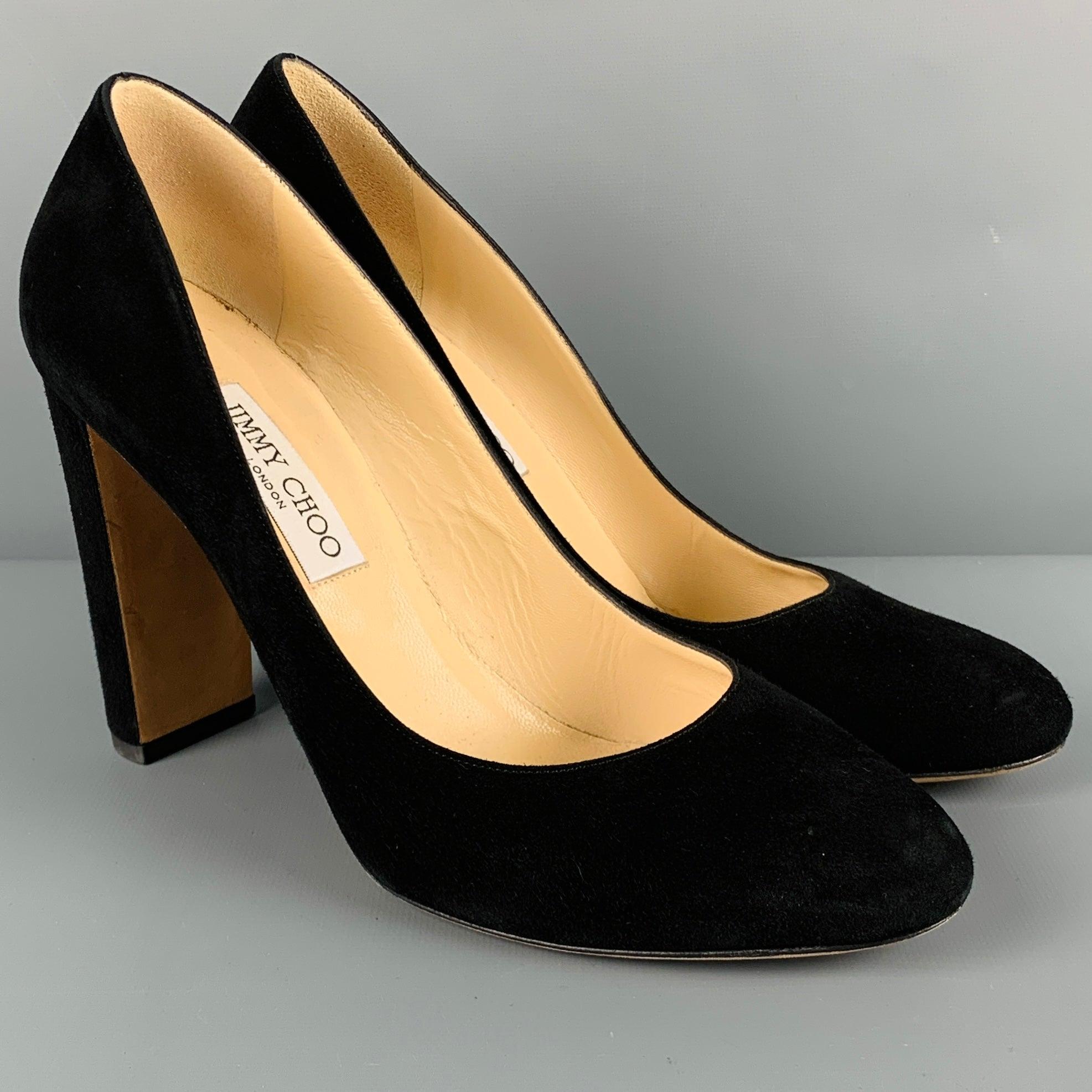 JIMMY CHOO pumps in a black suede fabric featuring a chunky heel, and slip on closure. Made in Italy.Very Good Pre-Owned Condition. Minor signs of wear. 

Marked:   41.5 

Measurements: 
  Heel: 4.25 inches 
  
  
 
Reference No.: 129073
Category: