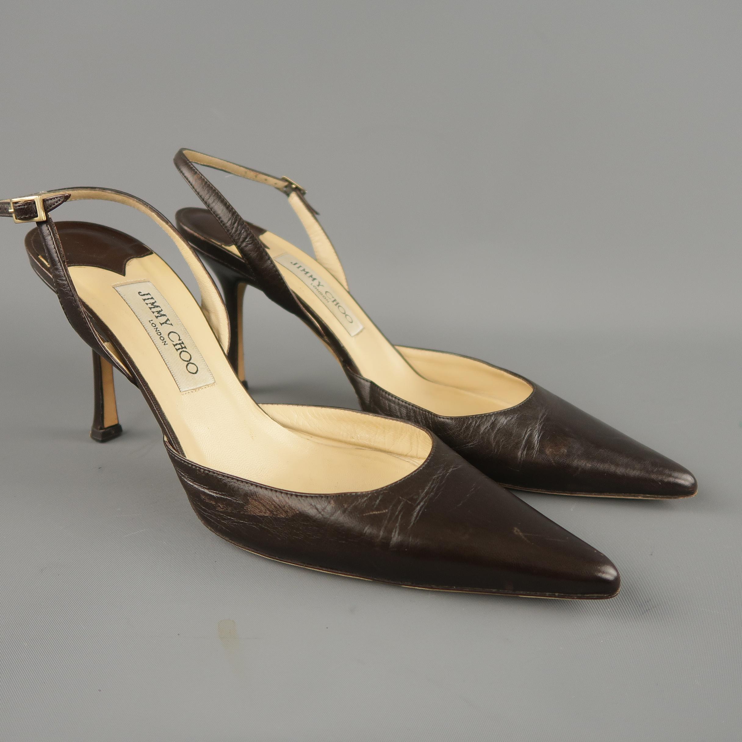 JIMMY CHOO pumps come in brown leather with a pointed toe, adjustable slingback strap, and covered stiletto heel. Wear throughout. Made in Italy.
 
Good Pre-Owned Condition.
Marked: IT 42
 
Measurements:
 
Heel: 4 in.