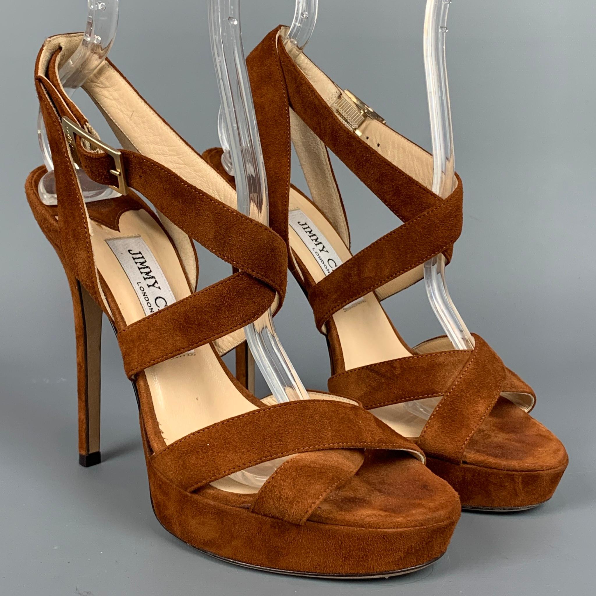 JIMMY CHOO sandals comes in a tan suede featuring a strappy style, platform, and a stiletto heel. Made in Italy.

Very Good Pre-Owned Condition.
Marked: IT 37

Measurements:

Heel: 5 in.
Platform: 0.5 in. 