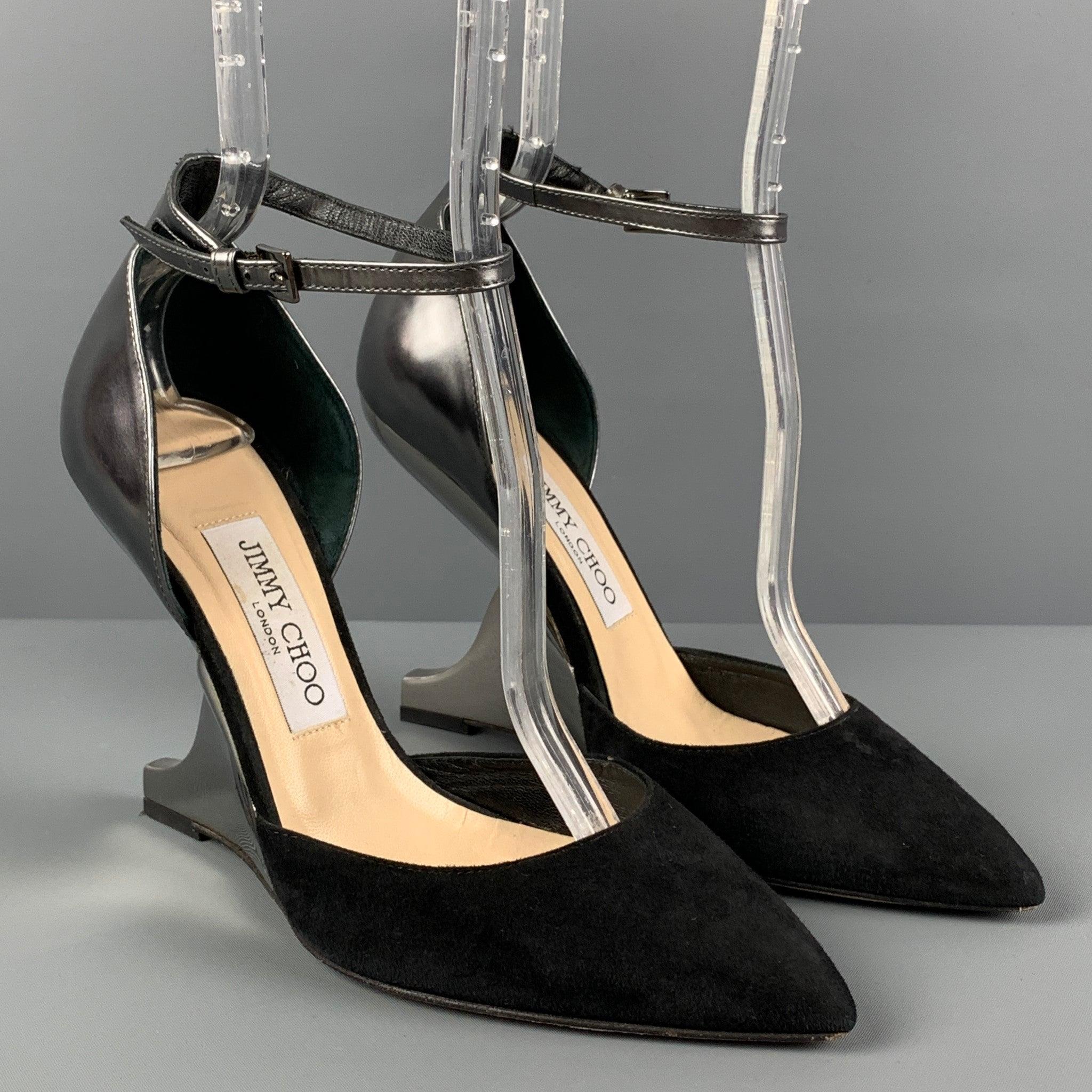 JIMMY CHOO pumps comes in a black suede with a silver leather panel featuring a pointed toe, ankle strap, and a curved mirrored heel. Made in Italy.
Very Good
Pre-Owned Condition. 

Marked:   37.5 

Measurements: 
  Heel: 4.25 inches 
  
  
