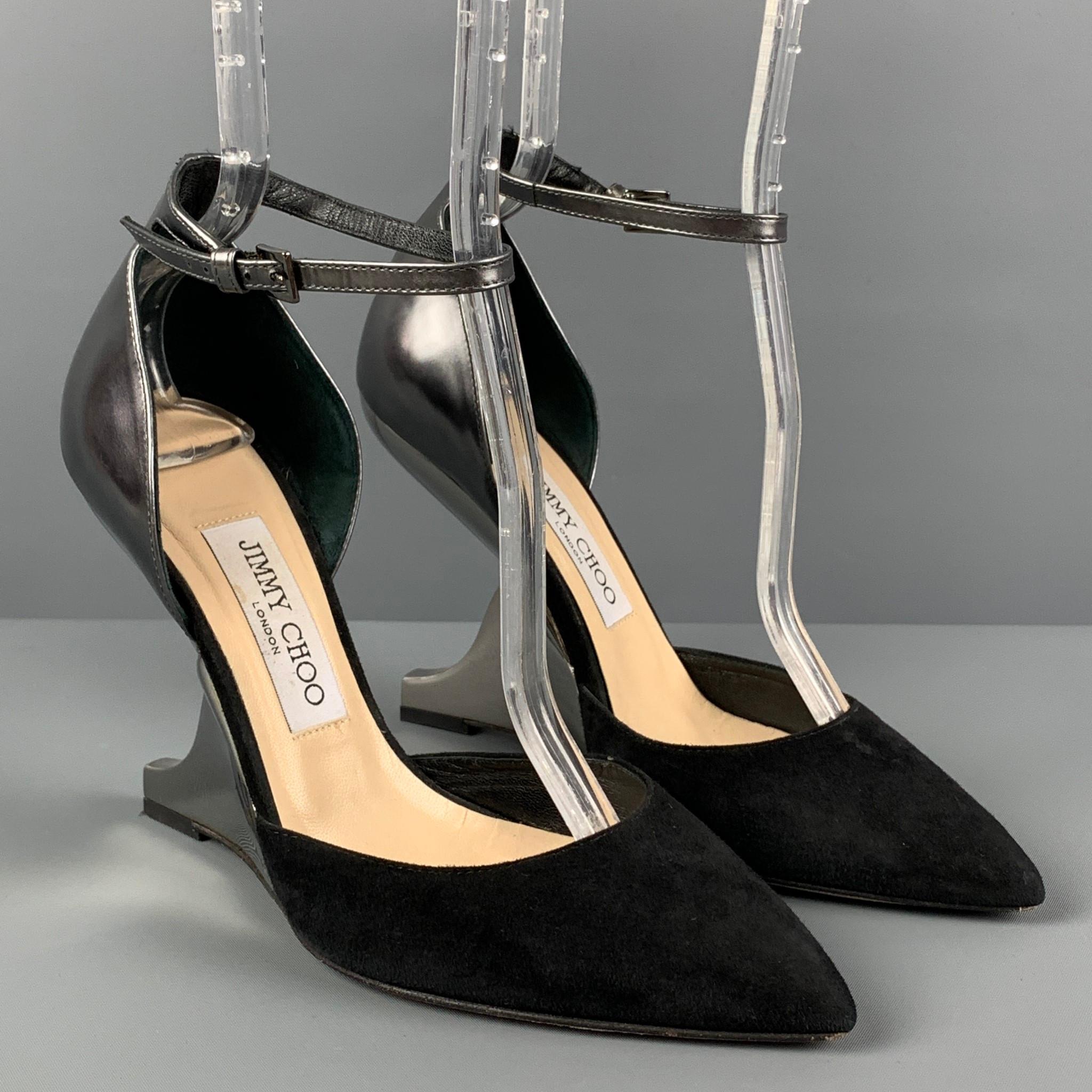 JIMMY CHOO pumps comes in a black suede with a silver leather panel featuring a pointed toe, ankle strap, and a curved mirrored heel. Made in Italy. 

Very Good Pre-Owned Condition.
Marked: 37.5
Original Retail Price: $850.00

Measurements:

Heel: