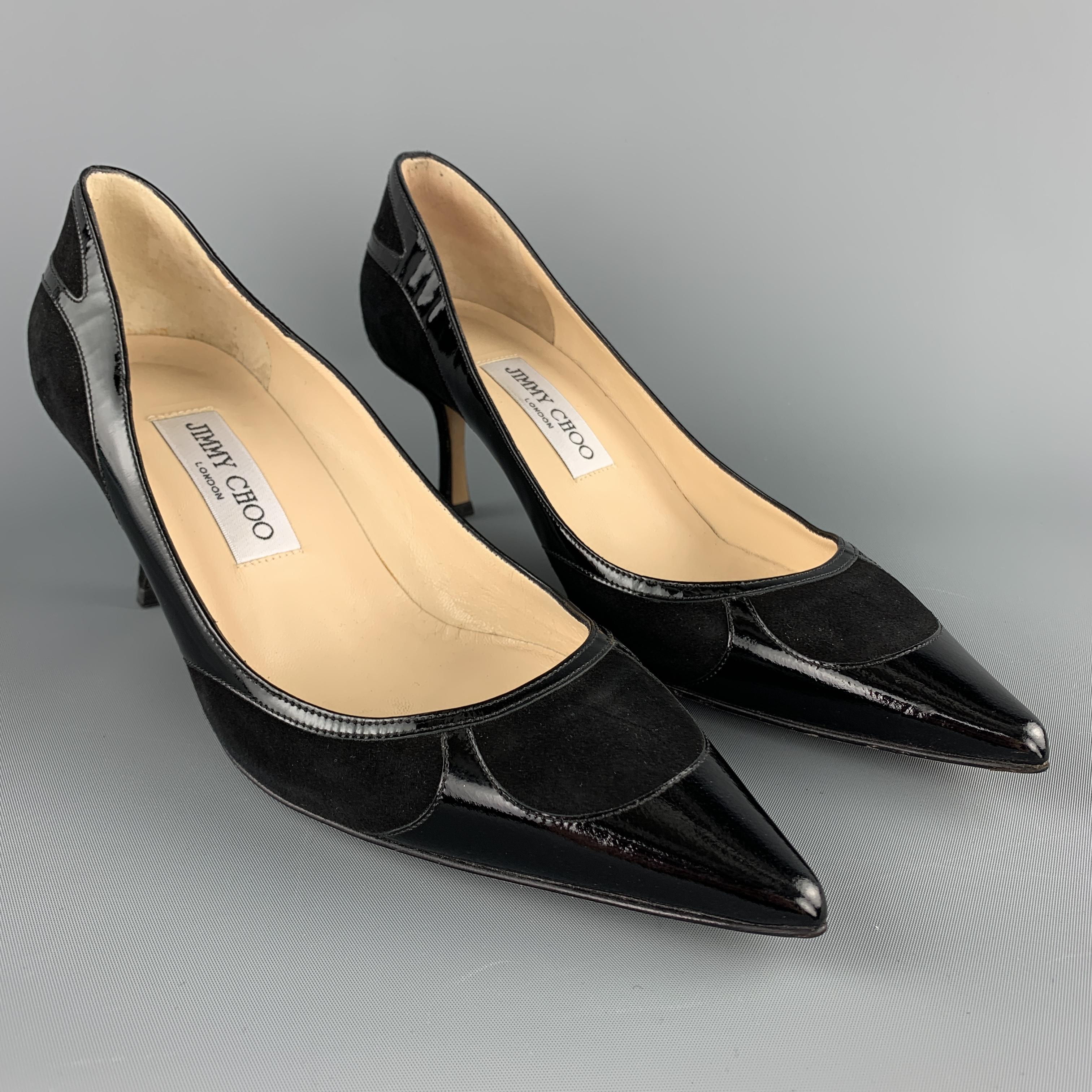 JIMMY CHOO pumps come in black suede with patent leather panels and a pointed toe. Made in Italy.

Excellent Pre-Owned Condition.
Marked: IT 38

Measurements:

Heel: 2.75 in.