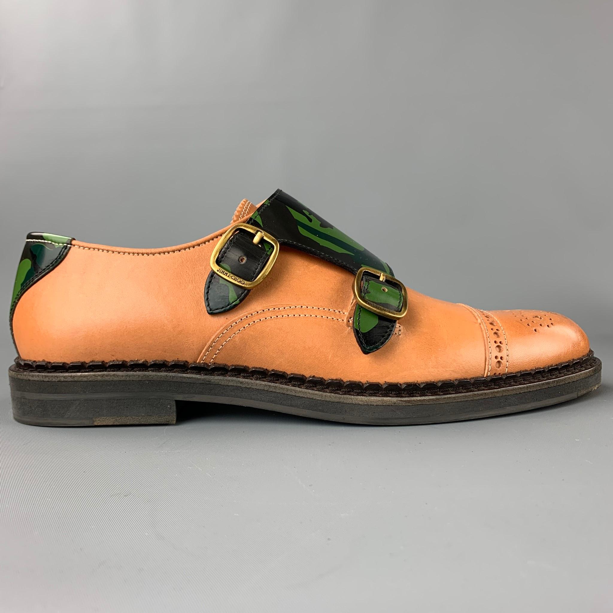 JIMMY CHOO loafers comes in a tan leather with a camouflage trim featuring a double monk strap, perforated, and a rubber sole. Made in Italy.

Excellent Pre-Owned Condition.
Marked: EU 41
Original Retail Price: $895.00

Measurements:

12 in. x 4 in.