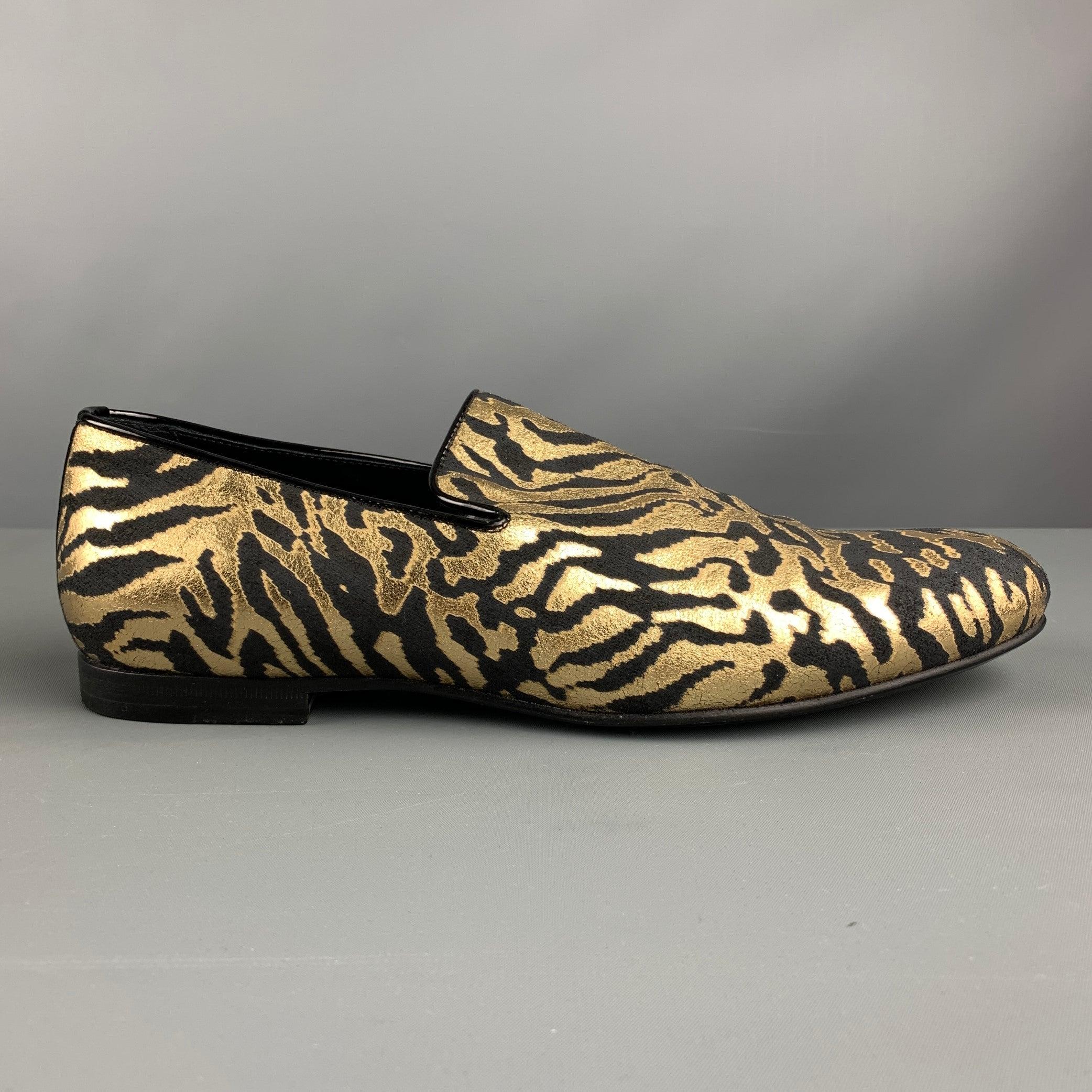 JIMMY CHOO loafers comes in a black & gold metallic animal print jacquard material featuring a slip on style. Includes Dust Bag. Made in Italy. Very Good Pre-Owned Condition. Signs of wear. 

Marked:   42Outsole: 11.75 inches  x 4 inches 
  
  
