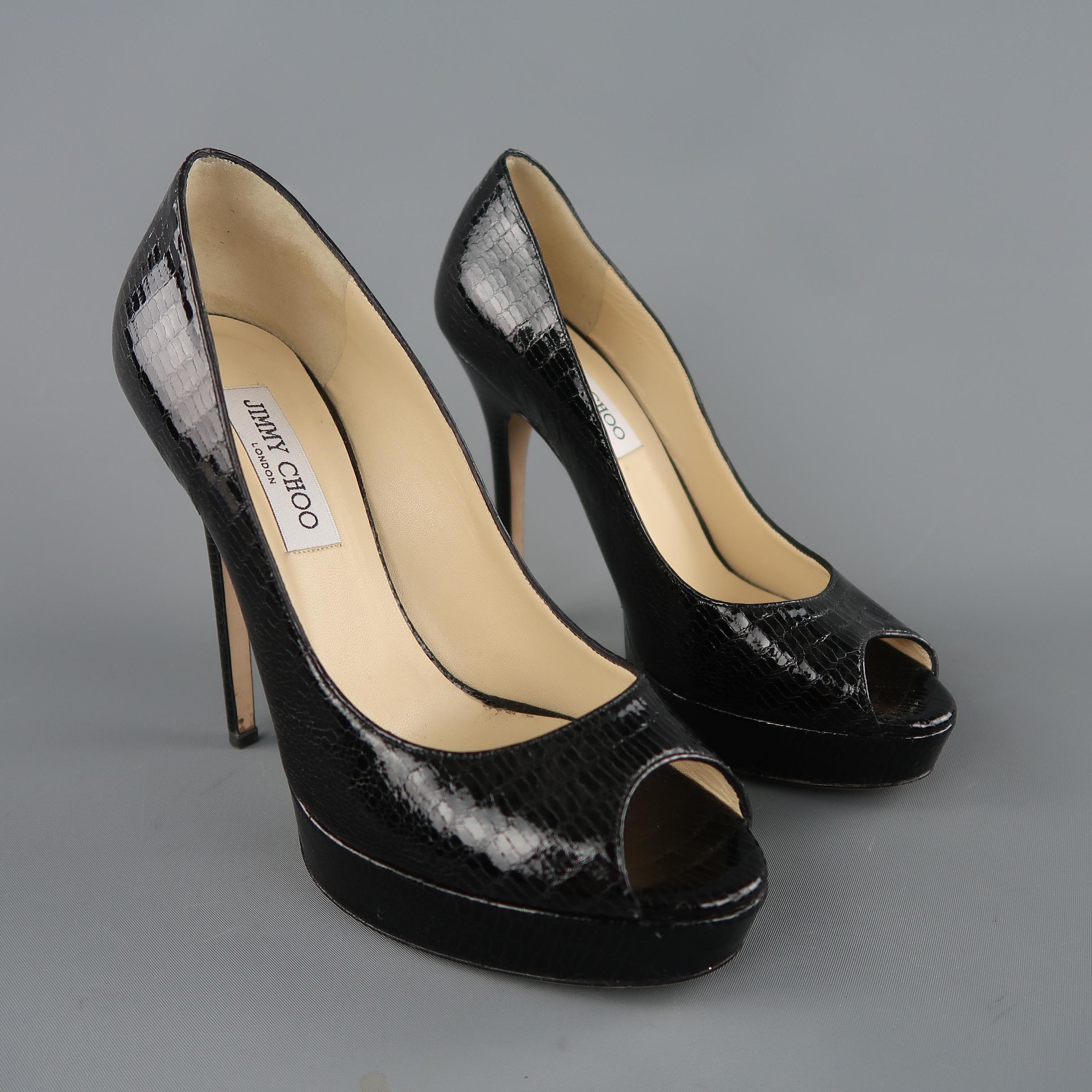 JIMMY CHOO pumps come in shiny lizard embossed leather with a peep toe, covered platform, and covered stiletto heel. Made in Italy.

Original retail price $695.00
 
Excellent Pre-Owned Condition.
Marked: IT 39
 
Measurements:
 
Heel: 5.25