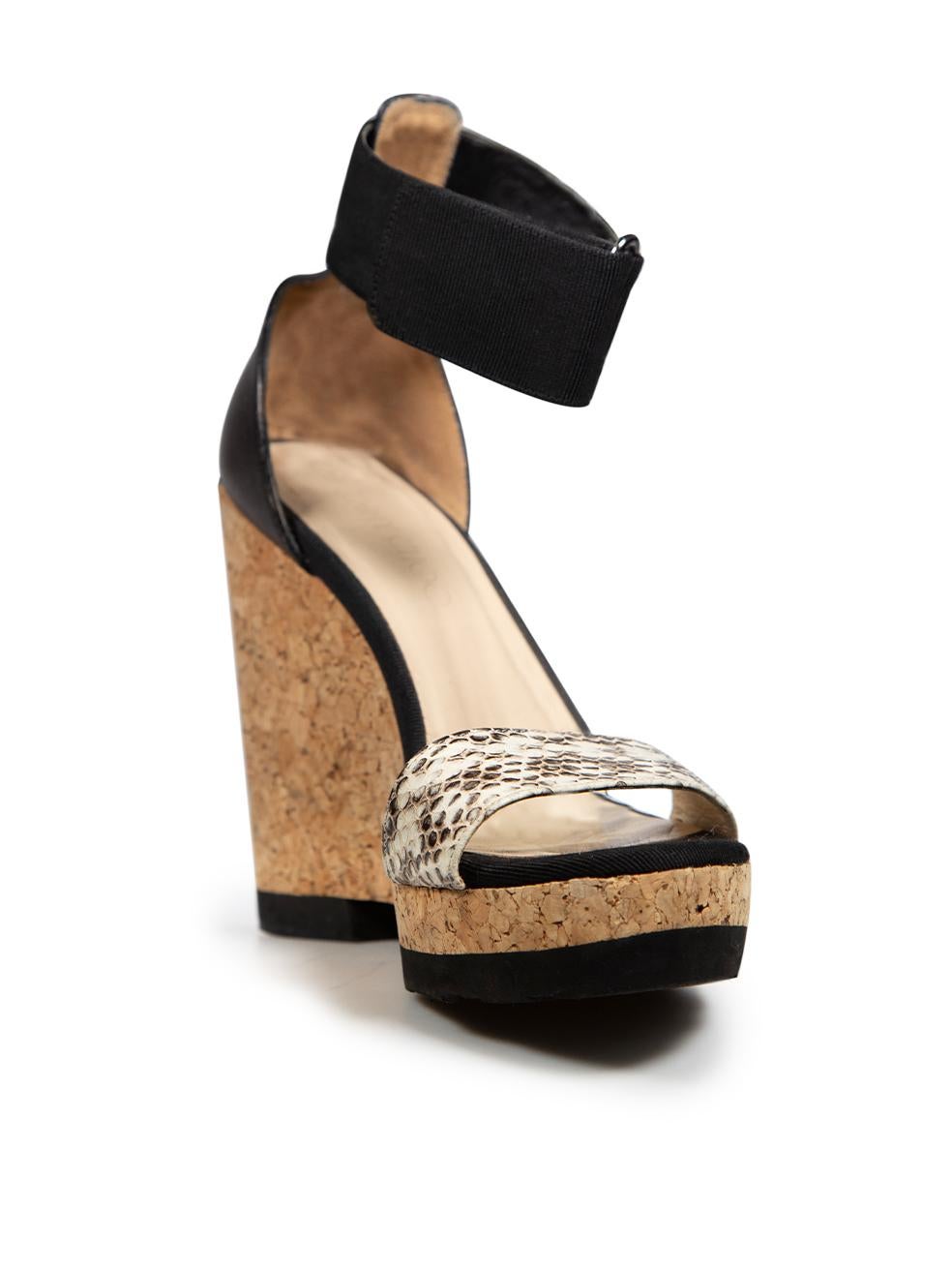 CONDITION is Good. General wear to sandals is evident. There is discolouration along the heel and toe areas on the insoles. There are abrasions and wear across the inside heel counters on this used Jimmy Choo designer resale item.
  
  
  
 