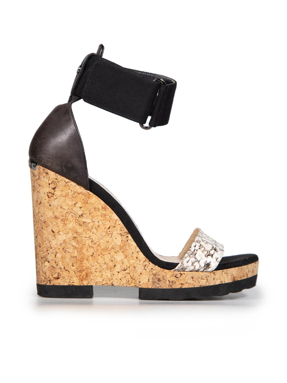 CONDITION is Good. General wear to sandals is evident. There is discolouration along the heel and toe areas on the insoles. There are abrasions and wear across the inside heel counters on this used Jimmy Choo designer resale item.
 

 

 

 Details
