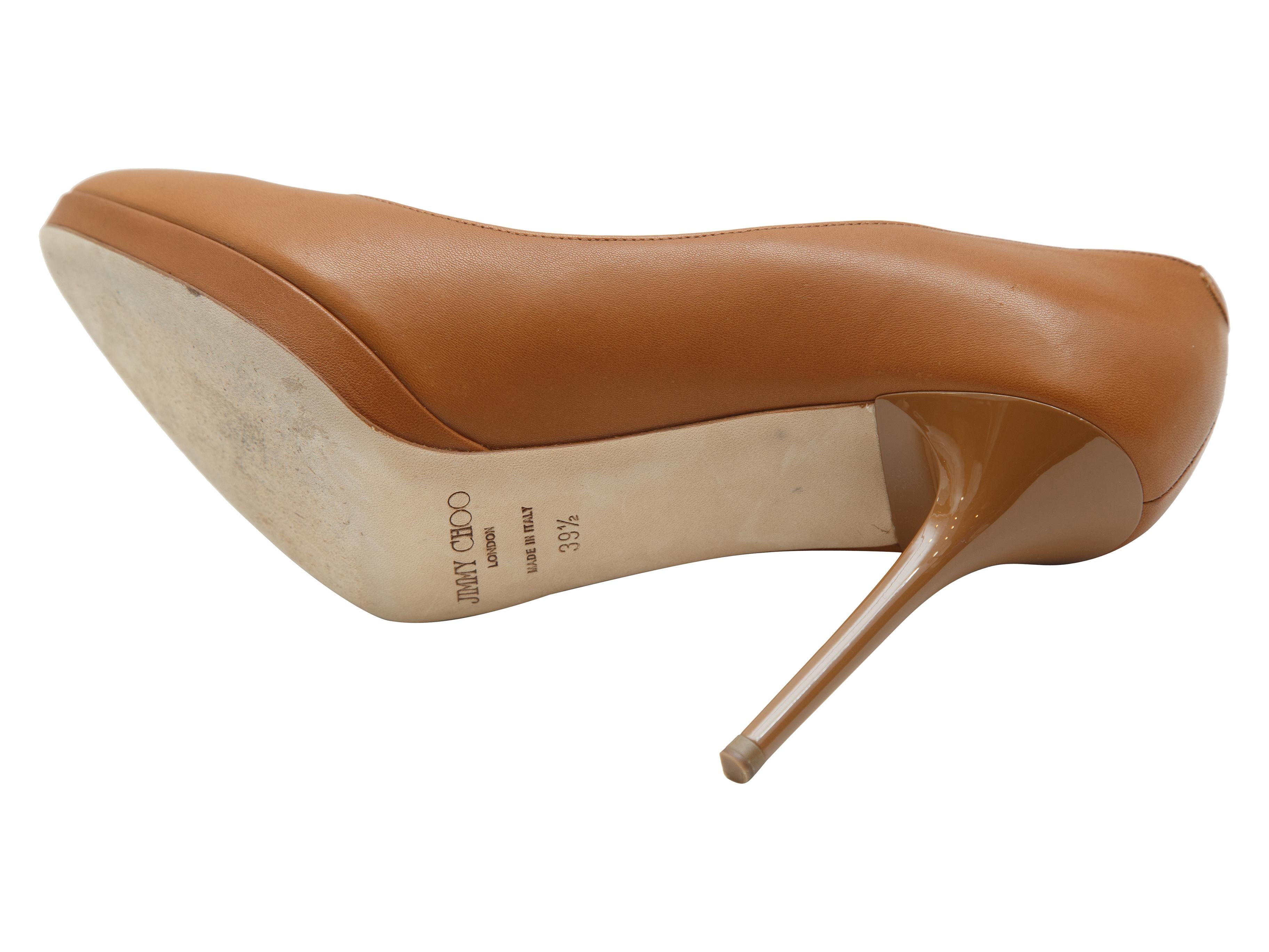 Product details:  Tan leather pumps by Jimmy Choo.  Round toe.  Low platform.  Slip-on style.  4