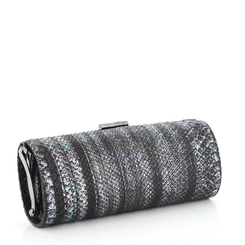 This Jimmy Choo Tube Clutch Python Long, crafted from genuine black and multicolor python, features gunmetal-tone hardware. It opens to a neutral satin interior. This item can only be shipped within the United States.

Condition: Great. Lifting of