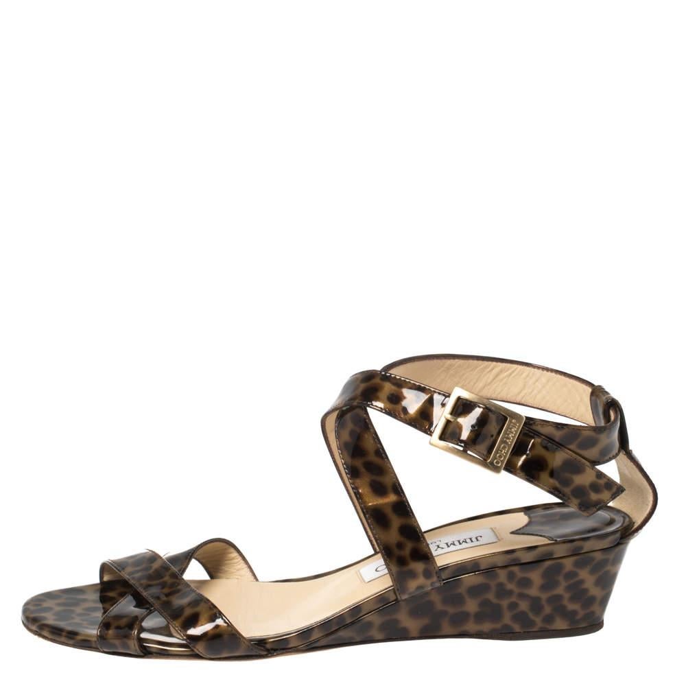 Frolic in comfort with these sandals from Jimmy Choo. They carry a simple design of leopard-printed patent leather straps and a set of comfortable wedge heels. They'll keep you at ease and look amazing on your feet.
