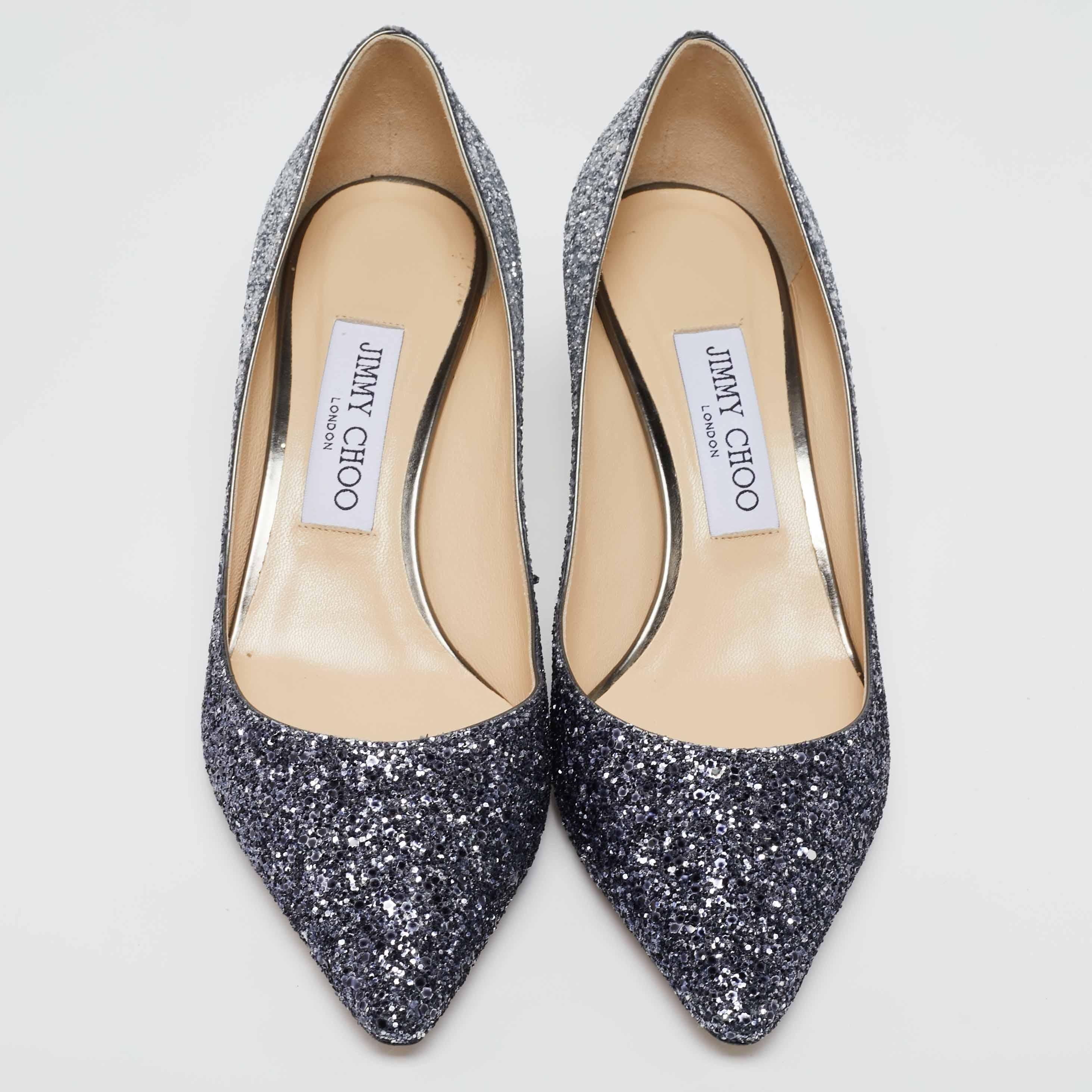 Known for their elegant and high fashion designs, Jimmy Choo never fails. Make a style statement while flaunting this pair that has been made in Italy. Crafted from glitter, they feature pointed toes, 6.5 cm heels and snug insoles.

Includes: