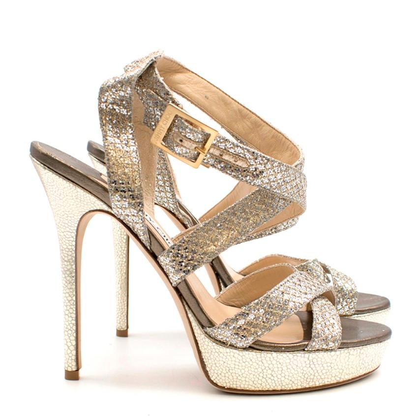 Jimmy Choo platform sandals have an open round toe, crossover straps at front and a designer-stamped gold buckle-fastening ankle strap.

Please note, these items are pre-owned and may show signs of being stored even when unworn and unused. This is