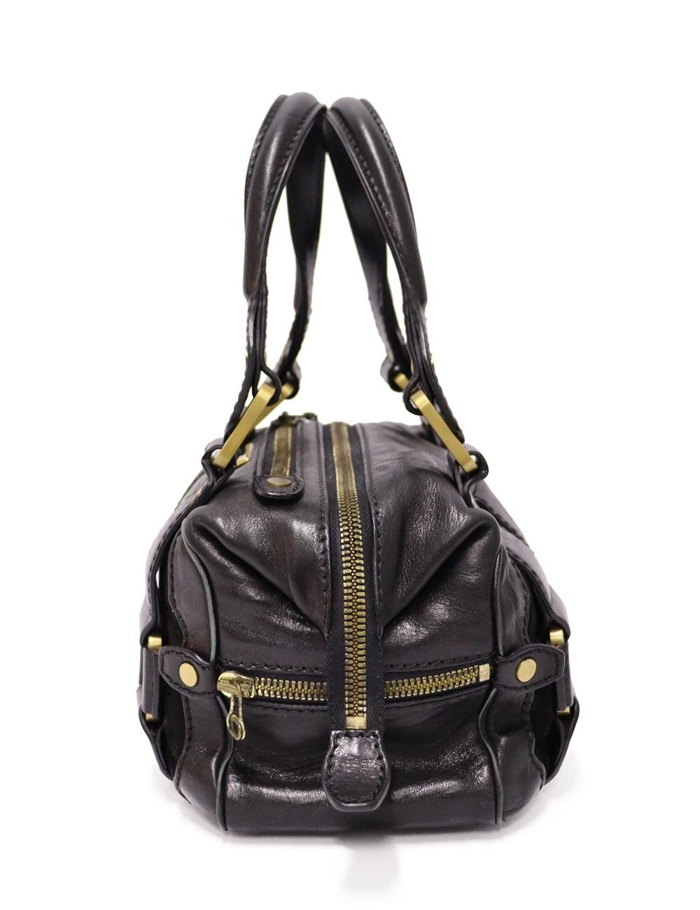 Jimmy Choo vintage black leather and suede shoulder bag.

Additional information:
Material: Leather and suede
Hardware: Gold
Measurements: 28 W x 13 D x 17 H cm
Handle Drop: 18cm
Overall condition: Good
Interior condition: Signs of use
External