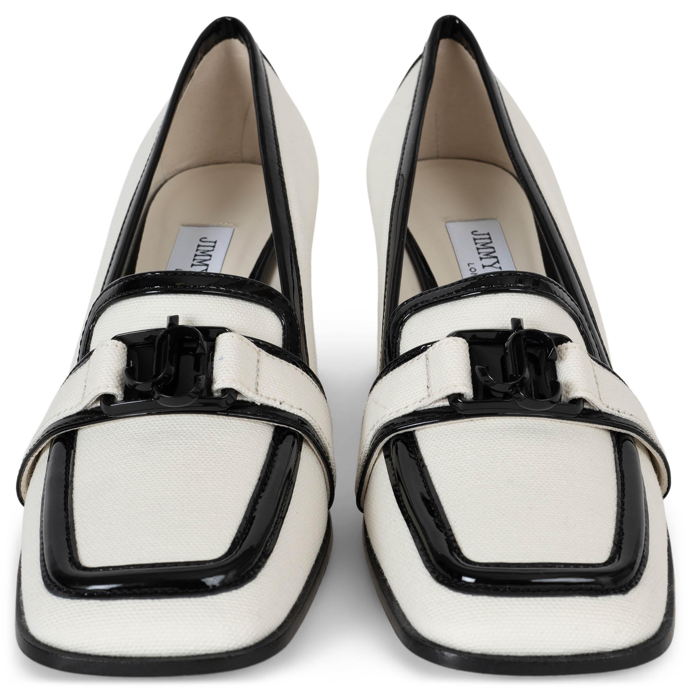 This 100% authentic Jimmy Choo Evin 65 pumps in white linen canvas (100%) exude timeless sophistication with a modern edge. Trimmed with sleek black patent leather, they feature square toes, block heels, and a bold logo detail across the front. A
