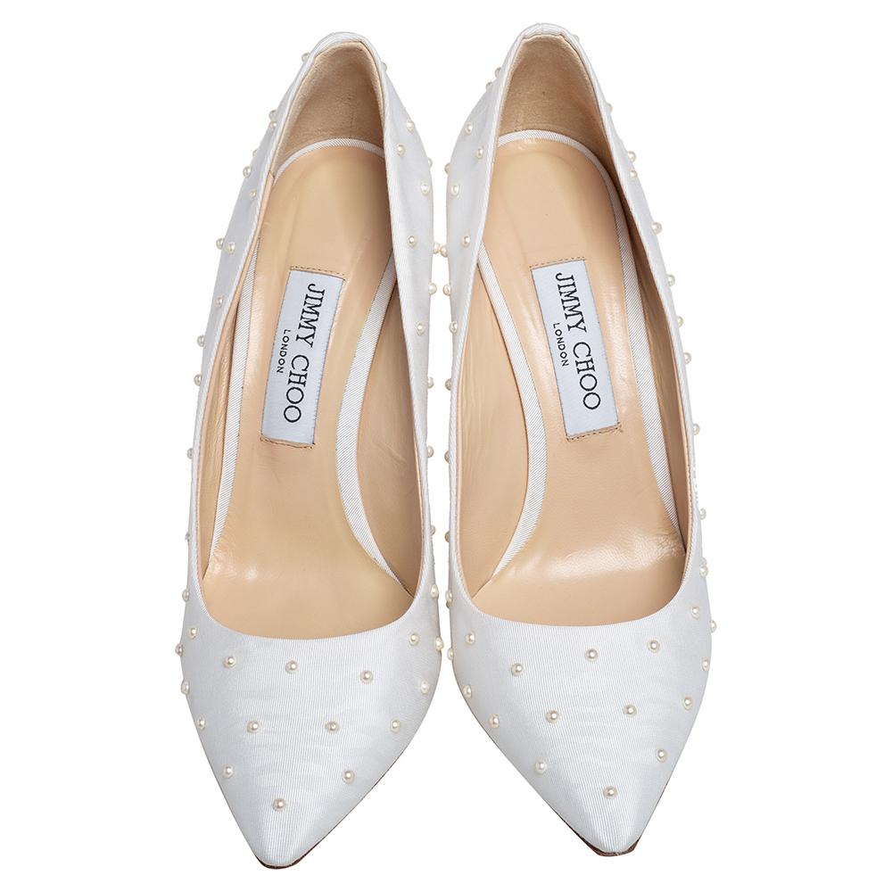 Known for their elegant and high fashion designs, Jimmy Choo never fails. Make a style statement while flaunting this Romy pair that has been made in Italy. Crafted from canvas and decorated with dainty pearls, they feature pointed toes, 11 cm heels