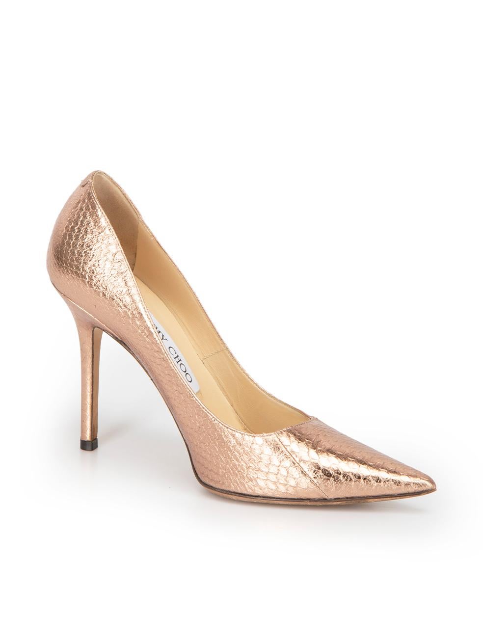 CONDITION is Very good. Minimal wear to heels is evident. Minimal wear to the insole and outsole on this used Jimmy Choo designer resale item. This item includes the original shoebox.



Details


Metallic bronze

Leather

Slip on pumps

Embossed