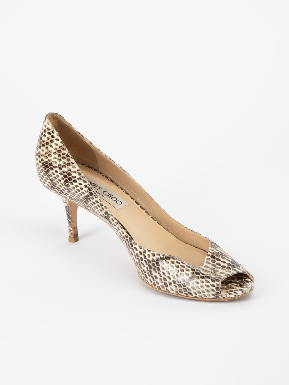 CONDITION is Very good. Minimal wear to shoes is evident. Wear to inner suede material and inner left heel tip on this used Jimmy Choo designer resale item. This item comes with original dustbag.
 
 Details
  Grey
 Snakeskin leather
 Slip on heels
