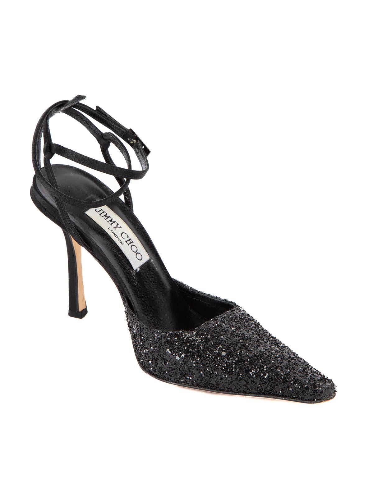 CONDITION is Very good. Minimal wear to heel is evident. Minimal wear to outsole and some of the glitter sequins has come off on this used Jimmy Choo designer resale item.   Details  Black Glitter, leather Ankle strap Buckle fastening High heel