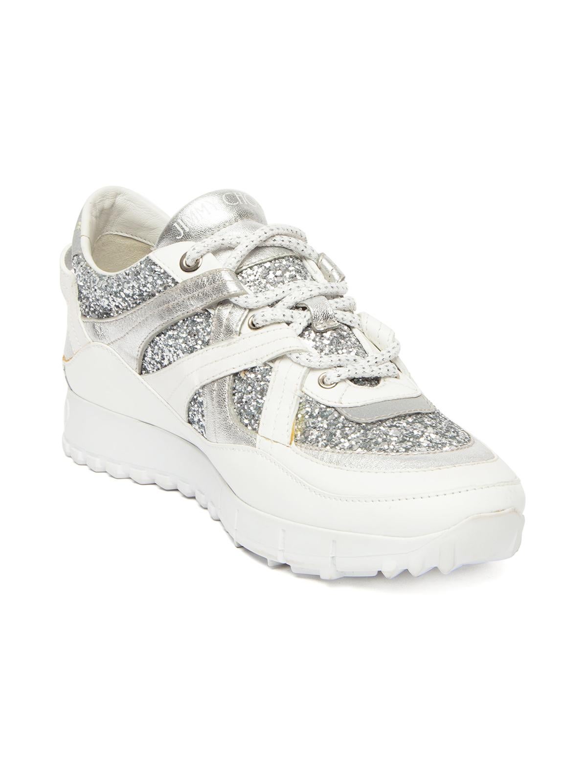 CONDITION is never worn. No wear to shoes is evident. Barely visible glue coming off the edges of the right shoe on this brand new Jimmy Choo designer resale item. Details Seattle model White Leather Chunky heel Round toe Metallic trim Metallic